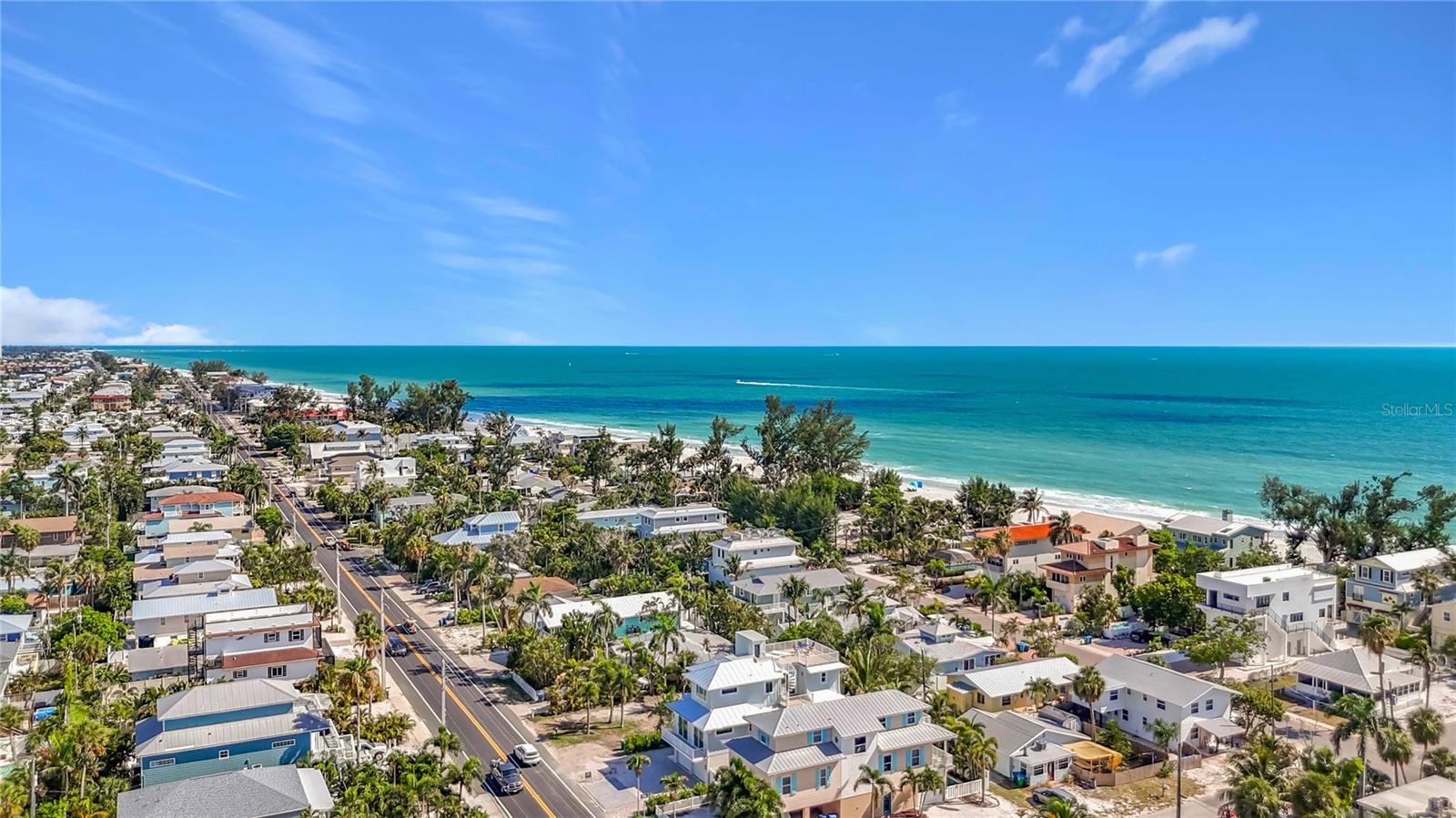 Just One Block from the Beach – Brand New Luxury Coastal Retreat  Experience the ultimate in island living with this stunning brand-new luxury home located just one block from the beach. Thoughtfully designed with exceptional craftsmanship and modern coastal elegance, this residence offers the perfect combination of luxury, lifestyle, and investment potential. Featuring 4 spacious bedrooms, 4.5 baths, and a den, every bedroom includes its own en-suite bath, providing comfort and privacy for family and guests alike. Custom wood cabinetry and detailed trim work throughout the home are complemented by beautiful stone countertops and high-end finishes. A private elevator provides convenient access to all levels, including the spectacular rooftop deck where you can enjoy breathtaking sunset views and coastal breezes. Whether entertaining guests or unwinding after a day at the beach, this rooftop oasis is truly a standout feature.Step outside to your own tropical paradise, complete with a resort-style pool and spa surrounded by lush landscaping. With the beach just steps away and easy access to local restaurants, shopping, and island attractions, this home offers exceptional walkability and an unbeatable coastal lifestyle.  Whether you're searching for a full-time residence, vacation home, or high-performing investment property, this exceptional coastal retreat offers it all.