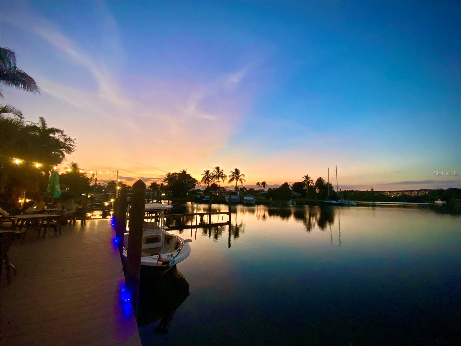 NO RENTAL RESTRICTIONS at this studio condo in Sarasota, Florida! Enjoy staying in this updated unit which is located inside a waterfront community with direct access to the GULF WATERS. This studio has a full bathroom and microwave, cooktop & with mini fridge. With no minimum rental restrictions, you can enjoy the unit whenever you like or rent it out through AIRBNB, VRBO, or the onsite program. These condos surround a marina with gulf access. Enjoy stepping out onto the dock, into your boat or kayak, hop aboard a fishing charter, or simply sip on something tropical while watching the beautiful sunsets over the water. Owners are able enjoy the Ramada Hotel's Resort Lifestyle with amenities that include a waterfront restaurant/tiki bar (Tarpon Bay Grill and Tiki Bar), the heated waterfront pool, beach volleyball, the fitness room, roaming security, community laundry, and other common areas. The monthly condo/HOA fees include all utilities, making your overhead expenses easy to budget. Centrally located to Sarasota Airport, downtown Sarasota, the world-famous beaches, St. Armands Circle, IMG Academy, Anna Maria, Siesta Key Islands and more! This condo is a must see and a pleasure to show!