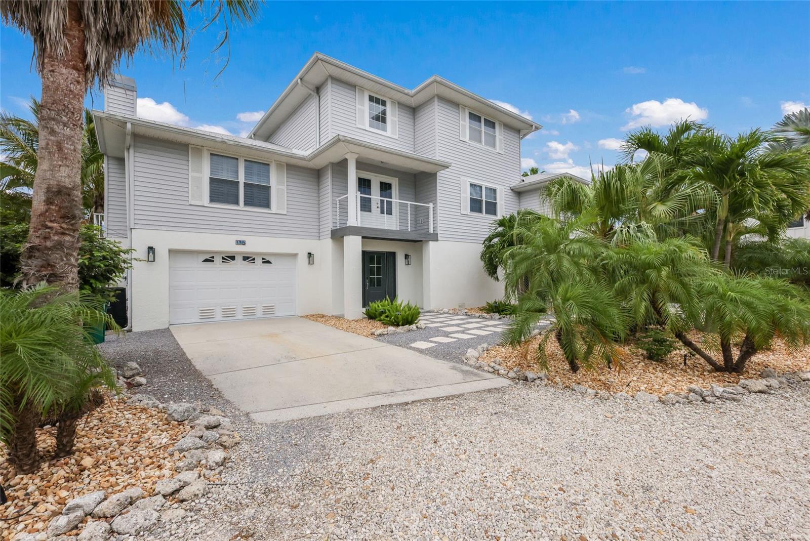 Introducing 115 Hammock Rd, a breathtaking elevated four-bedroom, three-bathroom home nestled in the heart of Anna Maria. This home comes furnished with a few exclusions. Ideally situated just one block from Pine Avenue, you’ll have easy access to a variety of restaurants and shops, along with a quick stroll to the pristine beaches of AMI. This residence has undergone a complete renovation in 2025, showcasing exquisite luxurious finishes that are sure to captivate. Upon entering, you'll be greeted by a beautifully designed living room featuring a cozy fireplace, perfect for relaxation. This space seamlessly connects to a stunning kitchen that overlooks a spacious balcony, spanning the entire width of the house—ideal for enjoying morning coffee or sipping a glass of wine while watching the sunset.
The first living floor also includes three large bedrooms, two bathrooms, making it an excellent space for hosting guests. Ascending to the third level, you'll find the expansive primary suite, complete with a private office, luxurious shower, and a soaking tub, providing a perfect retreat for relaxation and tranquility.
The spacious lower level offers ample room for parking, games, and storage, enhancing the home's functionality. Step into the stunning backyard, which features a lush tropical oasis complete with mature landscaping and a large pool—perfect for embracing a resort-style lifestyle. Whether you’re seeking a second home, a primary residence, or a lucrative rental opportunity, this property is an exceptional choice!
