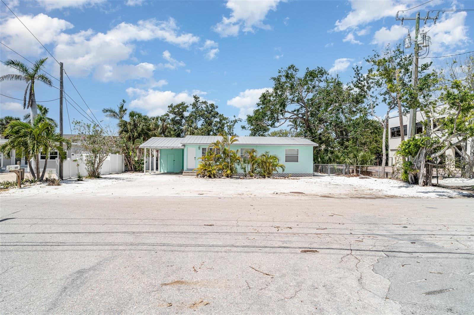 This property in the heart of Siesta Key Village is zoned OPI — Office, Professional, and Institutional — making it one of a very small number of properties in the Village where a business can legally operate. Buyer to verify intended use with the county.
The structure is a furnished 3-bedroom, 1-bath cottage with a full kitchen, Florida room, and laundry. The metal roof is approximately 8 years old. Interior paint is fresh. A shell driveway provides on-site parking — genuinely rare in the Village, where street parking is limited and pedestrian traffic is constant.
The location positions it within blocks or a trolley ride to Siesta Key Beach, boutique retail, and a concentration of restaurants and services that draw consistent year-round foot traffic. The property has been used residentially and is configured for either continued residential occupancy or professional office conversion.
This is a niche offering suited to professionals, investors, or operators looking for a permanent presence in Siesta Key Village. There is no HOA. Lease minimum: 1 month. Financing: cash or conventional.