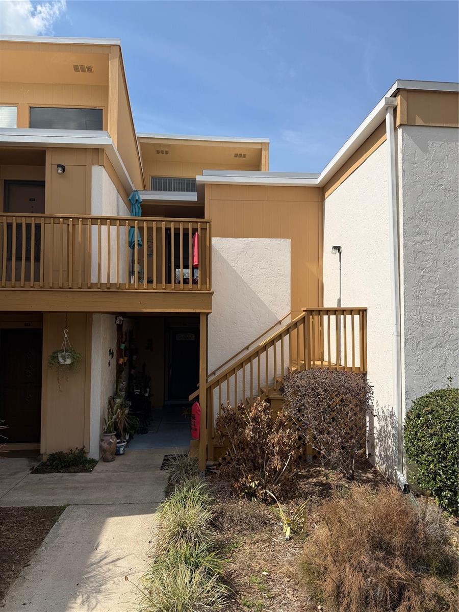 Discover the perfect blend of comfort and lifestyle in this airy second-floor condo, located in beautiful, historic Mount Dora. While many units feel tucked away, this 2-bedroom, 2-bathroom residence is defined by an extraordinary amount of natural light and a refreshing, open atmosphere. The heart of the home features soaring vaulted ceilings and a cozy wood-burning fireplace, but the real showstopper is the wall of patio doors. Open them up to invite in the famous Florida breeze and step out onto your private covered balcony. it is the ultimate spot for a morning coffee, watch a rocket launch,  or enjoy a sunset glass of wine. Or sneak off to the serene community pool. Two bright bedrooms offer ample storage and large windows that continue the home's airy theme. Nearly Maintenance-Free: The HOA handles the exterior, grounds, water, and trash, allowing you to spend your time enjoying the Mount Dora lifestyle rather than doing yard work. Prime Location.  You are perfectly positioned for work and play. Take a stroll to the vibrant downtown historic district to enjoy world-class dining, boutique shopping, and famous art festivals. Golf enthusiasts will love being steps away from the Mount Dora Golf Club, all while surrounded by the town’s iconic canopy oak trees and lakefront charm.