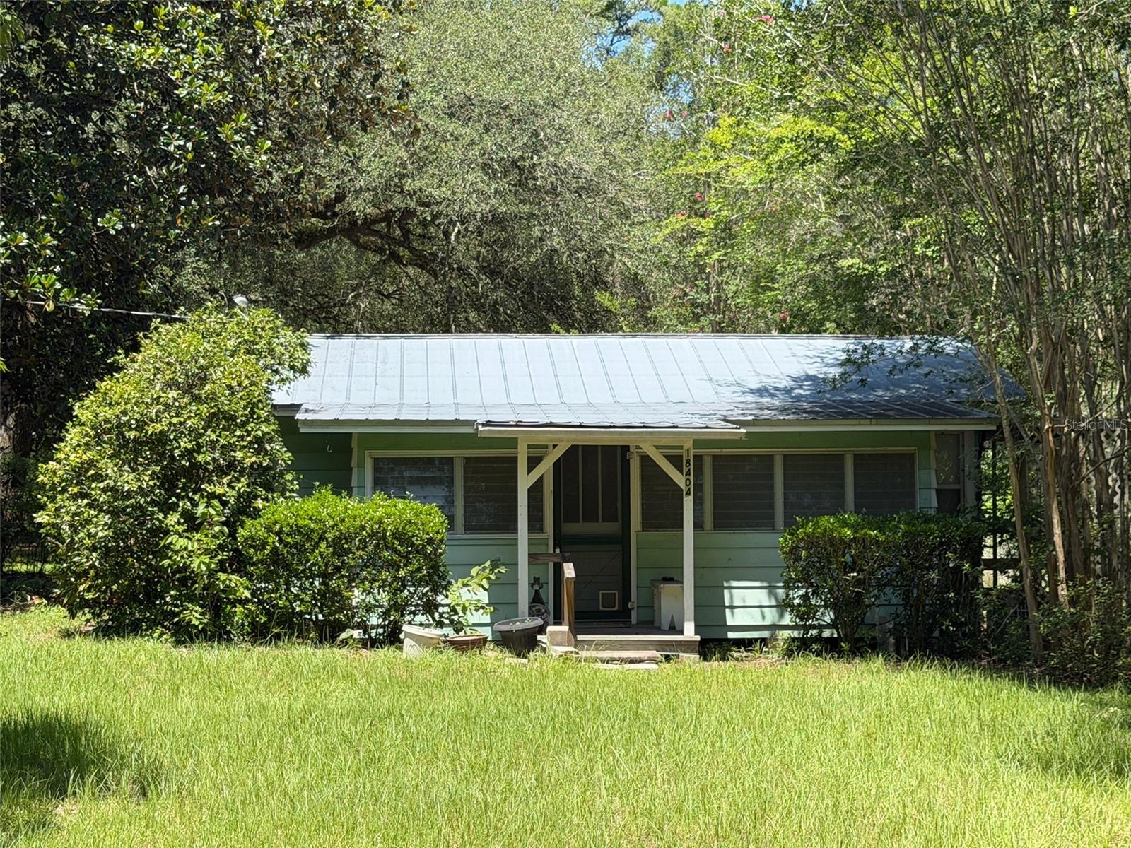 Rare 2-Acre Opportunity in High Springs!
Whether you're looking for your next investment project, a weekend getaway, or the perfect spot to build your dream home, this hard-to-find 2-acre property offers incredible potential in one of North Central Florida's most desirable areas.
The existing cottage-style home is ready for restoration with solid infrastructure, making it an excellent opportunity for renovation or a starting point while you plan for the future. The well and septic are in good working order, adding value and convenience for the next owner.
The true highlight of this property is the land. With two beautiful acres to enjoy, you'll have plenty of room for gardening, outdoor hobbies, or simply enjoying the privacy and peaceful surroundings.
Located just minutes from High Springs' renowned freshwater springs, including opportunities for swimming, kayaking, paddleboarding, and diving, this property also offers quick access to the charm of downtown High Springs, known for its local restaurants, antique shops, boutiques, and small-town atmosphere.
Whether you're an investor, builder, or someone looking for a property with room to grow, this is a rare chance to own acreage in a location where opportunities like this don't come along often. 
Bring your vision and unlock the potential of this unique High Springs property.