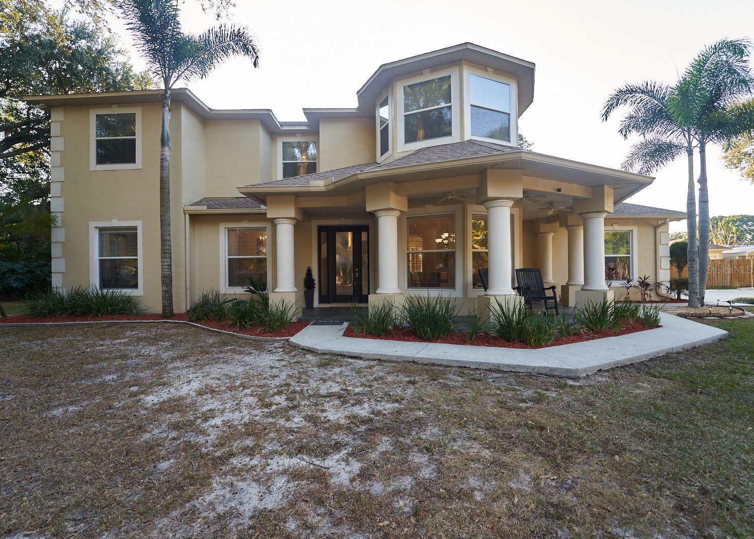 ***INCLUDES EXTRA ATTACHED BUILDABLE LOT*** INCLUDES IN-LAW SUITE***    This desirable, gated home, sits in an amazing central location in the heart of Brandon. Are you looking for privacy with a country feel? Are you looking for a custom home with an additional buildable lot? Are you tired of HOA and CDD fees? Look no further. Bring your Boats, RV's (area for RV has Hookup and 50 amp service), and any toys you may want . Imagine pulling into this private oasis as you come through it's private gate. As you look towards the left is a large open area (second buildable lot included). Look back towards the right and you will see a beautiful custom two story home with an attached two car side load garage, a seperate detached 3rd car garage (30 amp service), and an additional climate controlled workshop/craft room. As you enter in, you will be greeted into an inviting great room with soaring ceilings and a comfy woodburning fireplace. Kitchen is upgrade with granite countertops, an island with an additional sink and a built in dinette area for intimate family dining. Stainless steel appliances are conveying with the home. For your formal gatherings enjoy the front dining room with sweeping windows. Additionally there is a seperate bedroom with full bath including walk in shower featuring frameless glass door. Do you have a need for seperate living quarters for your familly members? This home features an IN LAW SUITE that has a seperate entrance with it's own Bedroom, full bath with walk in shower and frameless glass enclosure. Additionally the IN LAW SUITE has a seperate living room space that is also stubbed in for a small kitchen. The back large lanai is covered and offers a unique wrap around area for entertaining including watching you favorite sports and grilling. Going to the second floor living space by way of the grand staircase you overlook the greatroom. The large master suite features sweeping windows at the front with stunning view of the front property grounds. There are his and hers walk in closets. The Master Bath features two split sinks, jetted soaker tub, Large walk in shower with frameless glass enclosure. Additional features: Central Vacuum, Addl. connection for your portable generator (generator not incld.)