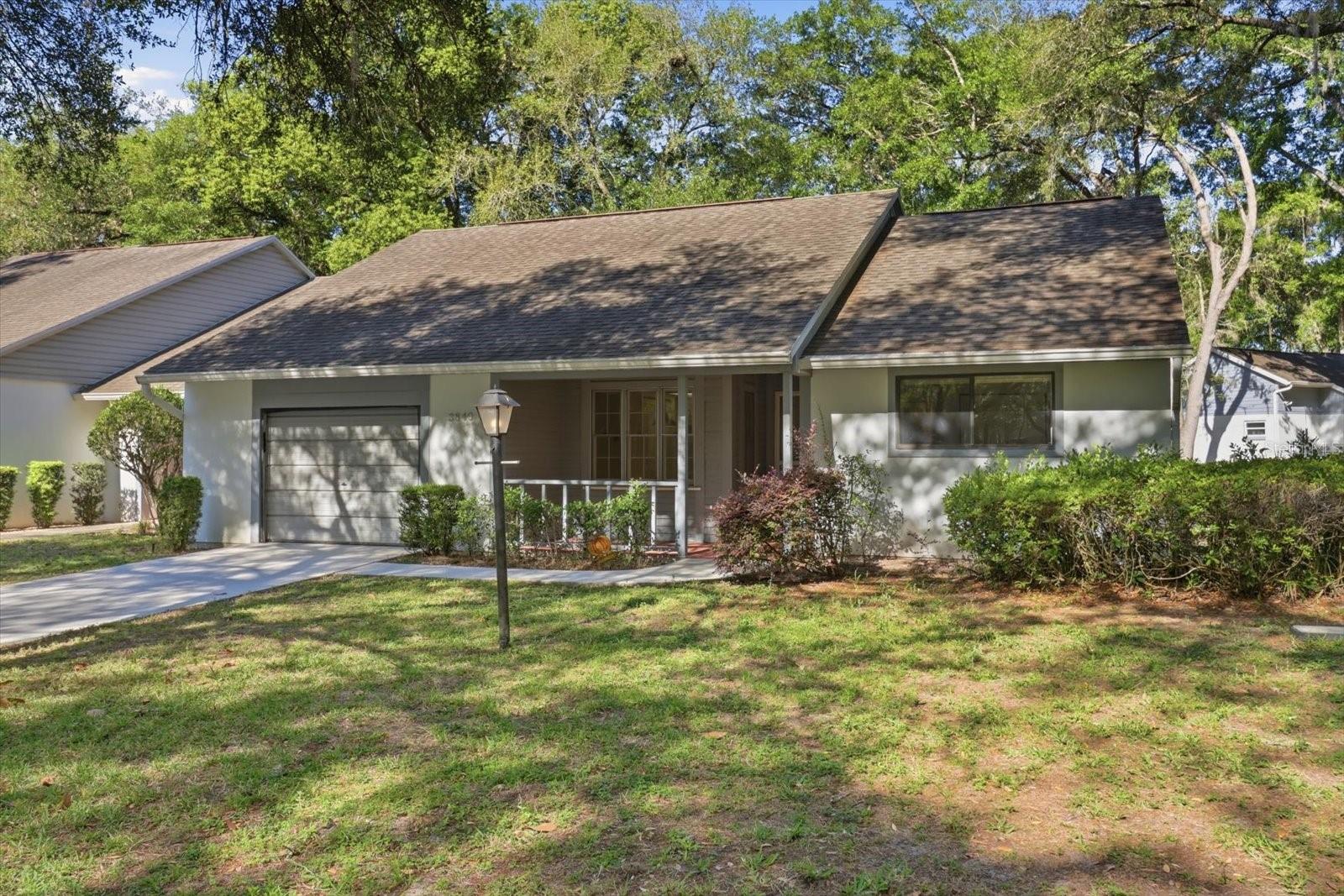 Welcome to the quintessential Florida lifestyle in this serene 55+ retreat, where peace and quiet aren't just perks—they are the standard. Nestled in a beautifully maintained neighborhood, this 2-bedroom, 2-bathroom home with a 1-car garage offers the perfect canvas for your next chapter. If you are looking for a property with "good bones" and the opportunity to build immediate equity through your own cosmetic touches, this is the one. While the interior awaits your personal style and modern updates, the heavy lifting is already managed for you. This community is designed for truly low-maintenance living; your monthly HOA fee covers lawn care, exterior painting, roads, and even roof replacement, allowing you to spend more time on the golf course or enjoying the local scenery and less time on home maintenance. Connected to reliable public water and sewer, this home provides a solid foundation in a stable, friendly environment. Imagine tailoring the kitchen and living spaces exactly to your taste, knowing the exterior integrity is fully looked after. Opportunities to secure a home with this much potential in such a tranquil setting are rare and tend to move quickly. Do not miss your chance to see how this space can be transformed into your ideal sanctuary. Contact us today to schedule your private tour and see the possibilities for yourself!