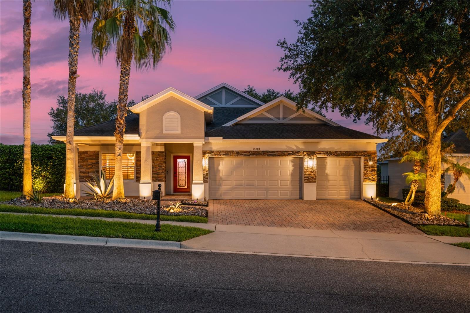 Some homes are simply updated. This one has a personality all its own. Welcome to this one-of-a-kind 4-bedroom, 4-bath home in the gated community of Carriage Pointe, where artistic design, modern renovations, and exceptional indoor-outdoor living come together to create a truly unforgettable home.
This oversized 0.34-acre corner lot sits on a quiet dead-end street with no neighbors to the left or rear. Mature privacy hedges surround the fenced backyard, creating a peaceful retreat, while two gated community entrances provide convenient access to shopping, dining, and major roadways.
From the moment you arrive, the home impresses with its stacked stone façade, paver driveway, oversized 3-car garage, and professionally landscaped grounds featuring majestic oak trees, palms, agave, and decorative rock landscape beds.
Inside, every detail has been thoughtfully designed. Updated flooring, beautifully renovated bathrooms, plantation shutters, and brand-new Reece impact-rated windows provide modern comfort, while artistic finishes add a distinctive character rarely found in residential homes. The welcoming foyer and formal living and dining spaces feature custom faux brick and textured wall finishes created by an artist who contributed to the Wizarding World attractions at Universal Orlando.
The beautifully renovated kitchen is designed for everyday living and entertaining with dramatic black-and-white quartz countertops, a full-height matching backsplash, a stunning waterfall-edge island, abundant cabinetry, breakfast bar seating, and a sunny breakfast nook overlooking the spacious family room.
The spacious primary suite offers a private retreat with a custom designer accent wall, dual walk-in closets, and a luxurious bath featuring dual vanities, a soaking tub, and a large frameless glass shower. Two secondary bedrooms share a convenient Jack-and-Jill bath, while the fourth bedroom and additional full bath provide flexibility for family, guests, or a home office.
A standout feature is the private upstairs bonus room with its own full bath. Professionally soundproofed and currently used as a DJ studio, this versatile space can easily become a recording studio, podcast room, theater, gaming lounge, fitness space, office, or private guest suite.
Enjoy Florida living year-round in the enclosed sunroom with insulated ceiling, creating a comfortable extension of the home's living space. Beyond awaits an incredible backyard retreat featuring a beautifully designed raised paver gathering space anchored by a grand wood-burning fireplace, creating the perfect outdoor setting for entertaining, relaxing, and enjoying evenings under the stars. Professional landscape lighting and mature privacy landscaping complete this special outdoor escape, with plenty of room to play, garden, or add a future pool.
If you've been searching for a home that feels anything but ordinary, you've found it. With its creative design, thoughtful updates, versatile spaces, and unforgettable backyard, this is more than a home - it’s a place where memories are made.