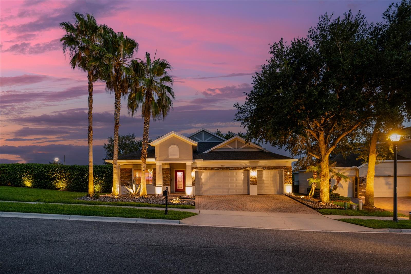 Some homes are simply updated. This one has a personality all its own. Welcome to this one-of-a-kind 4-bedroom, 4-bath home in the gated community of Carriage Pointe, where artistic design, modern renovations, and exceptional indoor-outdoor living come together to create a truly unforgettable home.
This oversized 0.34-acre corner lot sits on a quiet dead-end street with no neighbors to the left or rear. Mature privacy hedges surround the fenced backyard, creating a peaceful retreat, while two gated community entrances provide convenient access to shopping, dining, and major roadways.
From the moment you arrive, the home impresses with its stacked stone façade, paver driveway, oversized 3-car garage, and professionally landscaped grounds featuring majestic oak trees, palms, agave, and decorative rock landscape beds.
Inside, every detail has been thoughtfully designed. Updated flooring, beautifully renovated bathrooms, plantation shutters, and brand-new Reece impact-rated windows provide modern comfort, while artistic finishes add a distinctive character rarely found in residential homes. The welcoming foyer and formal living and dining spaces feature custom faux brick and textured wall finishes created by an artist who contributed to the Wizarding World attractions at Universal Orlando.
The beautifully renovated kitchen is designed for everyday living and entertaining with dramatic black-and-white quartz countertops, a full-height matching backsplash, a stunning waterfall-edge island, abundant cabinetry, breakfast bar seating, and a sunny breakfast nook overlooking the spacious family room.
The spacious primary suite offers a private retreat with a custom designer accent wall, dual walk-in closets, and a luxurious bath featuring dual vanities, a soaking tub, and a large frameless glass shower. Two secondary bedrooms share a convenient Jack-and-Jill bath, while the fourth bedroom and additional full bath provide flexibility for family, guests, or a home office.
A standout feature is the private upstairs bonus room with its own full bath. Professionally soundproofed and currently used as a DJ studio, this versatile space can easily become a recording studio, podcast room, theater, gaming lounge, fitness space, office, or private guest suite.
Enjoy Florida living year-round in the enclosed sunroom with insulated ceiling, creating a comfortable extension of the home's living space. Beyond awaits an incredible backyard retreat featuring a beautifully designed raised paver gathering space anchored by a grand wood-burning fireplace, creating the perfect outdoor setting for entertaining, relaxing, and enjoying evenings under the stars. Professional landscape lighting and mature privacy landscaping complete this special outdoor escape, with plenty of room to play, garden, or add a future pool.
If you've been searching for a home that feels anything but ordinary, you've found it. With its creative design, thoughtful updates, versatile spaces, and unforgettable backyard, this is more than a home - it’s a place where memories are made.
