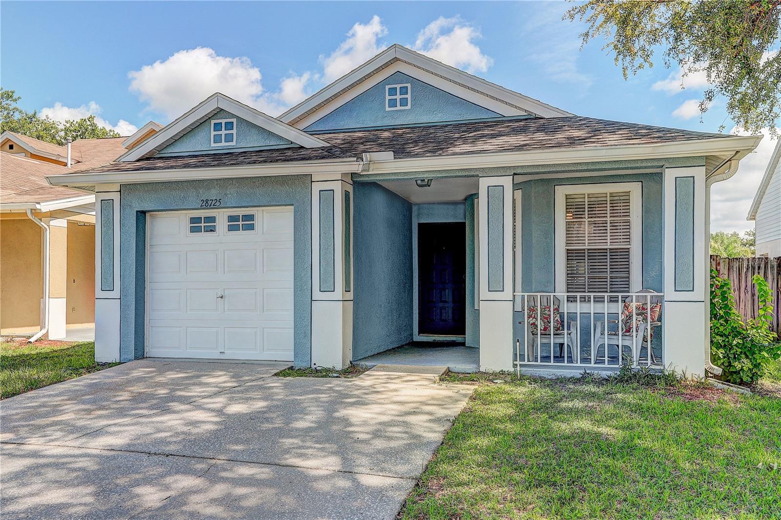 Welcome to 28725 Seashell Ct in Wesley Chapel! This charming 3-bedroom, 2-bath home offers 1,324 heated square feet and is tucked inside a gated community with a low HOA and NO CDD. Enjoy a welcoming front porch, screened-in back porch, and fenced yard, giving you plenty of space to relax, entertain, or enjoy the Florida weather.

Inside, you'll find stainless steel appliances, a water softener system, and a bathroom remodeled in 2017. The roof was replaced in 2017, and the washer and dryer convey with the home. Additional features include a 1-car garage and termite bait system.

Located in the heart of growing Wesley Chapel, this home puts you close to shopping, dining, and entertainment, with convenient access to SR 54 and I-75 for an easy connection throughout the Tampa Bay area. With no community amenities, you can enjoy the privacy of a gated neighborhood without paying for a long list of amenities you may never use.

A great opportunity to own a move-in-ready home in one of Wesley Chapel's most convenient and growing areas. Schedule your private showing today!