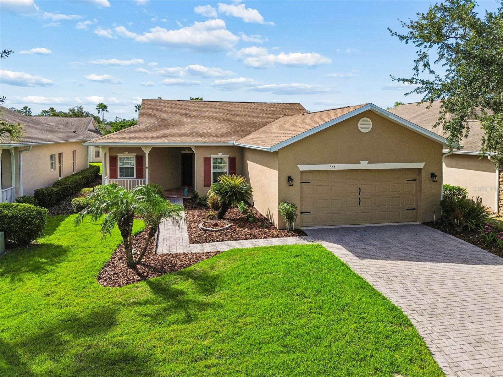 This meticulously maintained, sunny and bright, move-in-ready Allegro showcases pride of ownership throughout and offers numerous recent upgrades for peace of mind. Major improvements include the HVAC(2025), dishwasher (2018), washing machine (2025),  new roof (April 2024), water heater (July 2023), wood laminate flooring (July 2022), brand-new GE range (July 2026), refrigerator (June 2025), new GE microwave (August 2024), and smoke alarms (July 2025). Additional updates include a washing machine (2025), garage door opener mechanism and exterior paint(2023), lanai ceiling fan (2025), garage floor painted (2023), French drains (2014), and air vents professionally cleaned (February 2025).

Inside, you'll appreciate the bright, freshly painted main living area, the exceptionally clean and well-maintained condition, and an inviting breakfast bar that opens to the living space. The kitchen also features a generously sized pantry for additional storage. The spacious primary suite is enhanced by a beautiful granite countertop in the primary bathroom.

One of the home's standout features is the lovely tiled, enclosed Florida room under air with its own separate A/C system, providing comfortable year-round living space that's perfect for relaxing, entertaining, or enjoying your morning coffee.

Outside, you'll love the beautiful Florida landscaping and stunning water and preserve views from the front porch. The location is equally impressive, situated less than 200 feet from the neighborhood pool and offering convenient access in and out of the community through the Marigold Gate.

This exceptionally bright, neat, and meticulously cared-for home combines thoughtful updates, an outstanding location, and true move-in-ready condition, making it an exceptional opportunity to enjoy the Florida lifestyle.
Solivita is an award winning 55+ community featuring over 4200 acres of wetlands, parks and lakes, 150,000 sq ft of state of the art amenities and work out facilities, 14 heated swimming pools, 2 heated spas, 2 dog parks, tennis courts, pickleball courts, shuffleboard, bocce ball, billiards room, art gallery, community garden, 3 restaurants and 2 championship 18-hole golf courses. The large ball room hosts almost nightly events and the more than 200 clubs will ensure that you can find something fun to do! Join the travel club, the pizza club, the Disney club or do nothing at all while you sit peacefully in one of the many quiet park settings. Voted one of the top 6 communities in America, Solivita is close to the theme parks and all the wonderful adventures that Central Florida has to offer. Solivita is a little piece of paradise. Call us today!