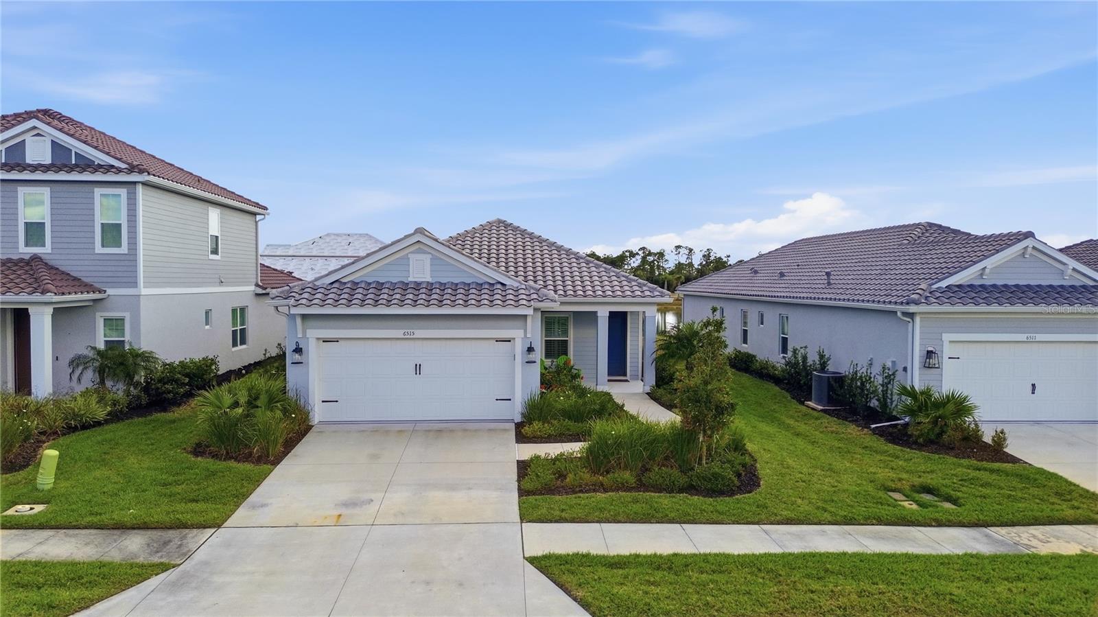 Welcome to this beautiful, almost-new home built in 2024, offering 3 bedrooms, 2 bathrooms, a versatile den, and 1,775 square feet of thoughtfully designed living space filled with natural light. The open-concept floor plan creates a seamless flow between the living, dining, and kitchen areas—perfect for both everyday living and entertaining.
This home is loaded with upgrades, including elegant crown molding, tray ceilings, custom woodwork, impact windows, and many additional designer touches that elevate the space throughout. Large sliders showcase peaceful lake views, bringing a sense of tranquility into the home.
Located in the highly desirable Grand Park community, residents enjoy resort-style amenities including a luxury clubhouse, sparkling pool, pickleball courts, and a vibrant calendar of social events.
Grand Park also offers a prime location with convenient access to shopping, dining, I75, and the world-famous Siesta Key beach, making this home the perfect combination of comfort, style, and lifestyle. This is a wonderful opportunity to enjoy modern luxury living in one of the area’s most sought-after communities.