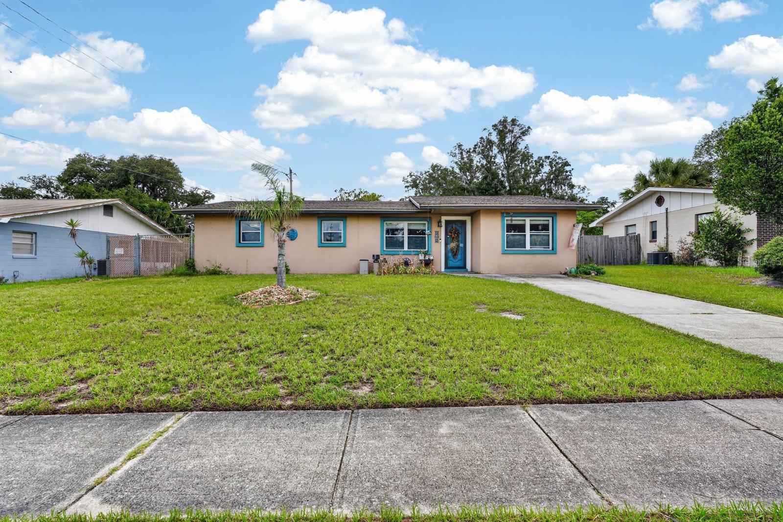 Concrete block stucco home at 212 Mimosa Drive in Palatka, offering 3 bedrooms, 1.5 bathrooms, and no HOA. The open floor plan connects the main living spaces, while the kitchen features stainless steel appliances. A large laundry room adds everyday convenience, and recent upgrades include a new water heater and new energy-efficient windows throughout. Step outside to a spacious screened-in back porch, ideal for entertaining, overlooking a fully fenced backyard with a storage shed included for extra space. With no HOA restrictions, this Palatka home is ready for its next owner.