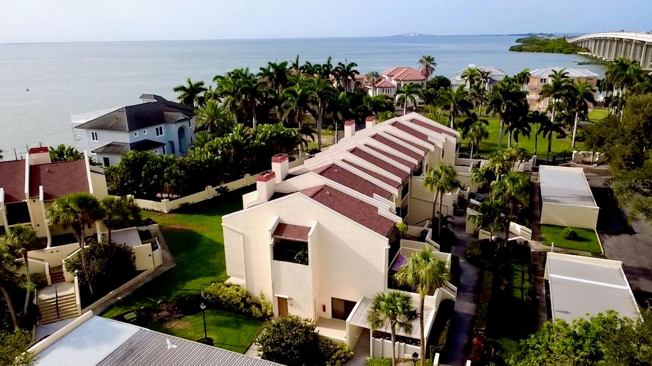 EVERYTHING IS BRAND NEW!  This 2-bedroom, 2-bathroom condo has been completely redone with all brand new flooring, all new GE kitchen appliances, completely new bathrooms, fresh new paint, new lighting, and an electric fireplace for those cool winter days!
Enjoy 4 large private patios that capture sunrises, sunsets, and refreshing ocean breezes. The grounds are beautifully landscaped with lush palm trees, mature greenery, and a tranquil ambiance. A heated waterfront community pool sits just steps away from many of the buildings, providing the perfect place to relax. The community also features a fishing pier, dock access, and convenient kayak launch and storage, making it ideal for anyone who loves being on the water. Tennis and pickleball courts offer additional recreation, and carports and guest parking ensure convenient access for both residents and visitors. This boutique-style community delivers low-maintenance, high-quality coastal living.
Situated next to the Skyway Bridge—well known for exceptional fishing—Seapointe Terrace offers unmatched convenience. Residents have quick access to downtown St. Petersburg to the north and an easy commute south to Bradenton or Sarasota. The vibrant Gulfport area is just minutes away, with its eclectic dining, shopping, and arts scene. St. Pete’s award-winning beaches, entertainment options, and everyday essentials are also just a short drive away.  ALL INFO IS INTENDED TO BE ACCURATE IT IS THE BUYER AND BUYERS AGENT TO VERIFY ALL INFORMATION.