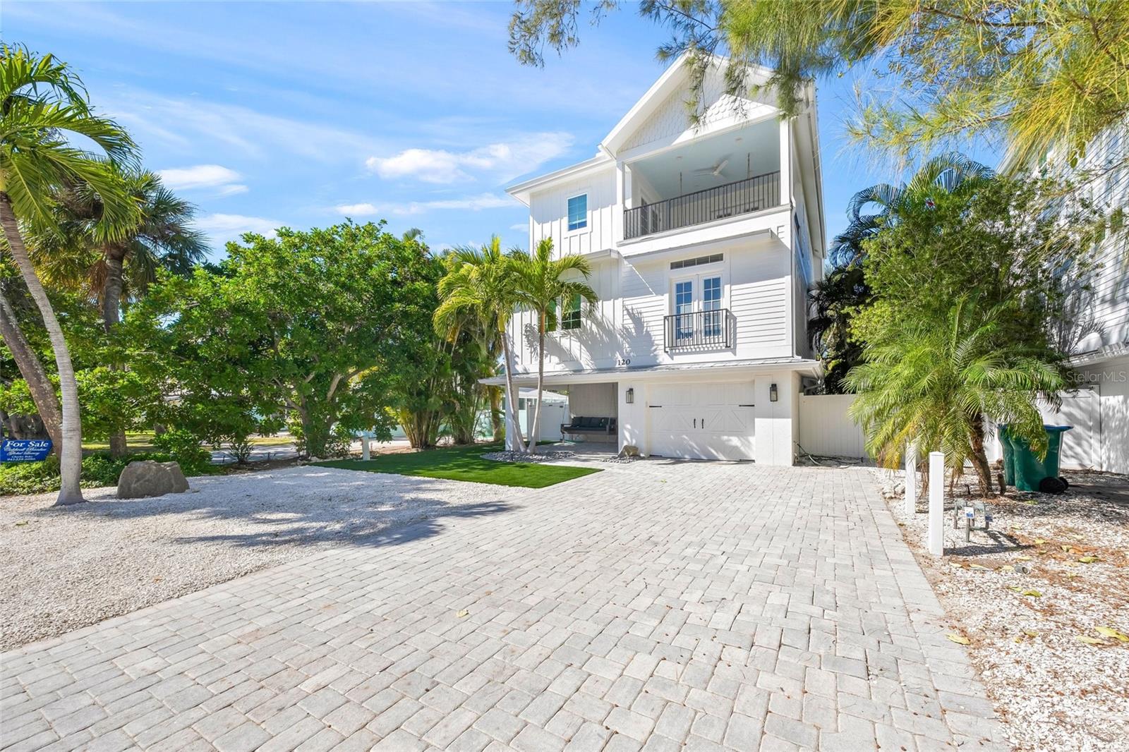 Nestled on Anna Maria Island’s most famous street, this beautifully renovated coastal retreat boasts five spacious bedrooms and four luxurious bathrooms, offering the perfect blend of comfort and style. Designed for seamless indoor-outdoor living, it features multiple porches where you can bask in the island breeze. Expansive sliding doors open to a generous deck, creating a natural flow between the elegant interiors and the lush tropical surroundings. Step down to the heated pool and spa, enveloped by vibrant landscaping, providing a secluded sanctuary for relaxation and entertainment. A private elevator enhances convenience, providing effortless access to all levels of the home and ensuring a seamless living experience. While the home’s prime location places you just steps from the beach, renowned as the best surfing spot on the island, it offers an ideal setting for surfers drawn to its incredible waves. With premier shopping and dining just minutes away, you’ll have the best of island living right at your fingertips.