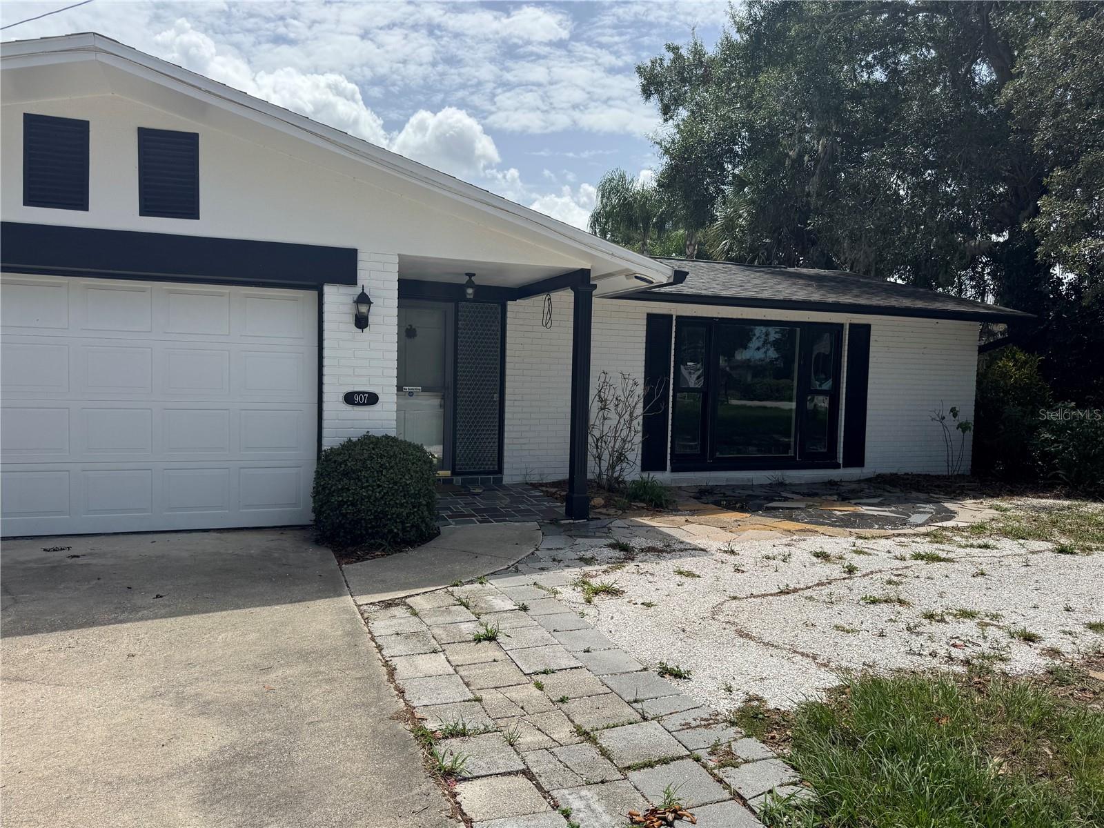 Short Sale. This 4-bedroom, 2-bath home with a 2-car garage is ideally located in beautiful Tarpon Springs with no HOA or CDD fees. Situated on an oversized, fenced lot with a 12-foot gate, there's plenty of room to park your boat, RV, or other recreational vehicles. The heated in-ground pool and spacious backyard create the perfect setting for relaxing or entertaining, while the detached workshop with electricity offers excellent space for hobbies, storage, or a home workspace.

Inside, you'll find a functional floor plan with generous living space, including an enclosed 300+ square foot porch with direct access to the pool and bathroom. Large bay windows in the living room provide beautiful sunset views, and the home's flexible layout allows you to separate living areas for added privacy. The windows and pool heater were replaced in 2017.