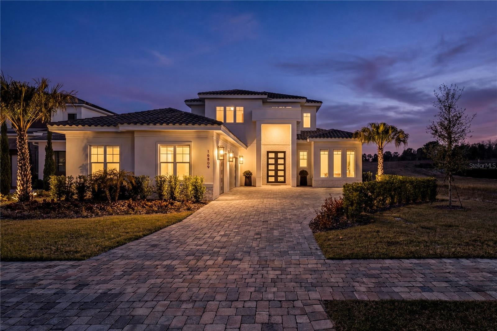 Stunning home in the exclusive guard-gated community Bella Collina. This beautiful estate, built by Davila Homes, offers 4 bedrooms, 4.5 bathrooms plus an office and over 3,900 SqFt of luxury living space. Designed with modern elegance, the open-concept layout features expansive living and dining areas, a gourmet kitchen with premium finishes, and seamless indoor-outdoor flow.

The seller has added several custom upgrades, including bedroom enhancements, living room built-ins, and custom window treatments—all of which will remain with the home. The primary suite provides a private retreat with a spa-inspired bathroom and oversized walk-in closet, while a second master bedroom on the upper level offers additional comfort and flexibility for family or guests. Additional bedrooms are generously sized with en-suite baths, ensuring privacy and convenience. A spacious laundry room includes a convenient dog wash station.

Enjoy resort-style living with a private pool, spa, and summer kitchen, all overlooking serene green surroundings. Bella Collina amenities include a world-class championship golf course designed by Nick Faldo, Tuscan-inspired clubhouse, full-service spa, fitness center, tennis courts, resort-style pool complex, and dining options. Located in Montverde, minutes from Winter Garden and just a short drive to downtown Orlando and the attractions.

Experience the luxury lifestyle you deserve at Bella Collina.