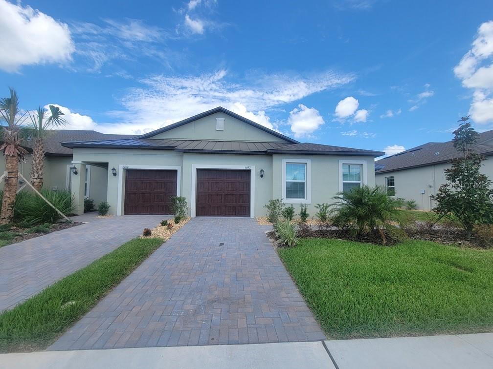 Enjoy a BRAND-NEW 55+ Villa built in 2026, located in the active adult community of New Port Corners!


This beautiful 2-bedroom, 2-bathroom home offers an open-concept living, dining, and kitchen area with wood-look tile flooring throughout. A versatile flex room provides the perfect space for a home office, reading nook, or den.

The chef-inspired kitchen features quartz countertops, a large island, pantry, stainless steel appliances, and ample cabinet and counter space. The living room opens to a screened-in lanai through sliding glass doors, creating the perfect indoor-outdoor living experience.

The split-bedroom floor plan provides added privacy for the spacious owner's suite, which includes a large walk-in closet, linen closet, and private en-suite bath with dual vanities, walk-in shower, and separate water closet. At the front of the home, you'll find the guest bedroom, full guest bath with walk-in shower, and access to the attached garage.

In addition to the one-car front-entry garage, this home features a rare bonus rear garage—perfect for golf cart parking, extra storage, or hobby space. An electric vehicle charging station is also included.

Residents of New Port Corners enjoy exceptional resort-style amenities, including a clubhouse with fitness center, resort-style pool (scheduled to open 8/1), pickleball courts, bocce ball courts, and a dog park. Conveniently located off Little Road, you'll be just minutes from shopping, dining, entertainment, and everyday conveniences.

Small pets welcome! Breed restrictions apply. Pet photo approval and a $200 non-refundable pet fee are required.