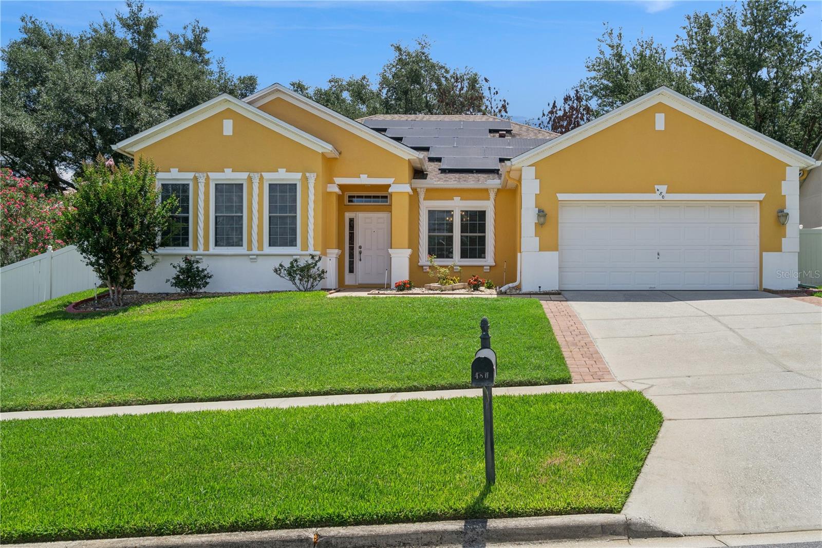 This 4-bedroom, 3-bathroom home in Clermont offers everything you need to move in and start living. Situated on a spacious 9,980 square foot lot in a family-friendly neighborhood with easy access to schools, shopping, and recreation. The layout is flexible and thoughtful formal dining and living rooms flank the foyer, giving you the space to use as needed. Hardwood floors run through the formal areas and all four bedrooms, adding warmth and durability. Crown molding accents throughout, and the kitchen features granite countertops.
The master bedroom is generous with a vanity, a big walk-in closet with built-in drawers, and plenty of space. The home is wired with surround sound capability, and two electronic fireplaces add ambiance. Two smart TVs—a 75-inch and a 55-inch are included with the sale.
A 2-car garage includes a built-in storage wall, keeping everything organized and accessible. Outside, the screened-in lanai has outdoor speakers and overlooks yard space—plenty of room if you want to add a pool down the road. Protection is in place with impact hurricane windows and accordion shutters. The roof was installed in 2017, and extra attic insulation keeps the home cooler and more efficient.
Solar panels are on the home, significantly reducing your monthly energy costs. The current owner pays only $33 per month in Duke Energy bills saving over $140 monthly compared to an average Clermont home. That's approximately $1,700 in annual energy savings with no maintenance required. The system is already installed and producing from day one. All the upgrades that typically require investment after purchase are already done here move-in ready without the renovation headache. The neighborhood offers the charm Clermont is known for, with convenient access to dining, shopping, and family activities. Proximity to the lake provides outdoor recreation and that Central Florida lifestyle families are looking for. Ready to enjoy immediately.