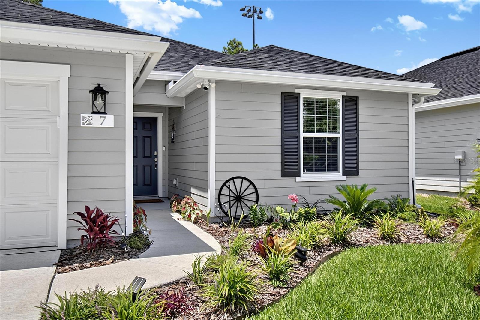 Welcome to this beautifully maintained, like-new 3-bedroom, 2-bath home with a dedicated office and an extended 2-car garage, ideally situated on a quiet cul-de-sac just over 2 miles from Flagler Beach. Built in 2025, this exceptional residence offers the perfect blend of modern luxury, comfort, and peace of mind with included hurricane shutters.

Step inside to discover luxury vinyl flooring throughout and an open-concept layout designed for both everyday living and entertaining. The chef-inspired kitchen features stunning quartz countertops, 42-inch cabinetry, stainless steel appliances, a gas range, and abundant prep and storage space. The spacious living room is enhanced with a surround sound system, creating the perfect atmosphere for movie nights or gatherings.

The private owner's suite and additional bedrooms offer comfort and functionality, while the dedicated office provides an ideal work-from-home space. New faucets throughout the home add a fresh, stylish touch.

Outdoor living is equally impressive. Relax year-round on the covered, screened lanai complete with two oversized ceiling fans and a natural gas hookup for the Blackstone griddle. Unwind in the two-person hot tub situated on an attractive paver patio, surrounded by a fully vinyl-fenced backyard accented with solar lighting. A storage shed, irrigation system, and pristine curb appeal complete this outstanding property.

Conveniently located near restaurants, shopping, scenic trails, schools, the hospital, and major roadways, this move-in-ready home offers the Florida lifestyle you've been dreaming of. Don't miss this incredible opportunity to own a better-than-new home in one of Flagler Beach's most desirable locations!