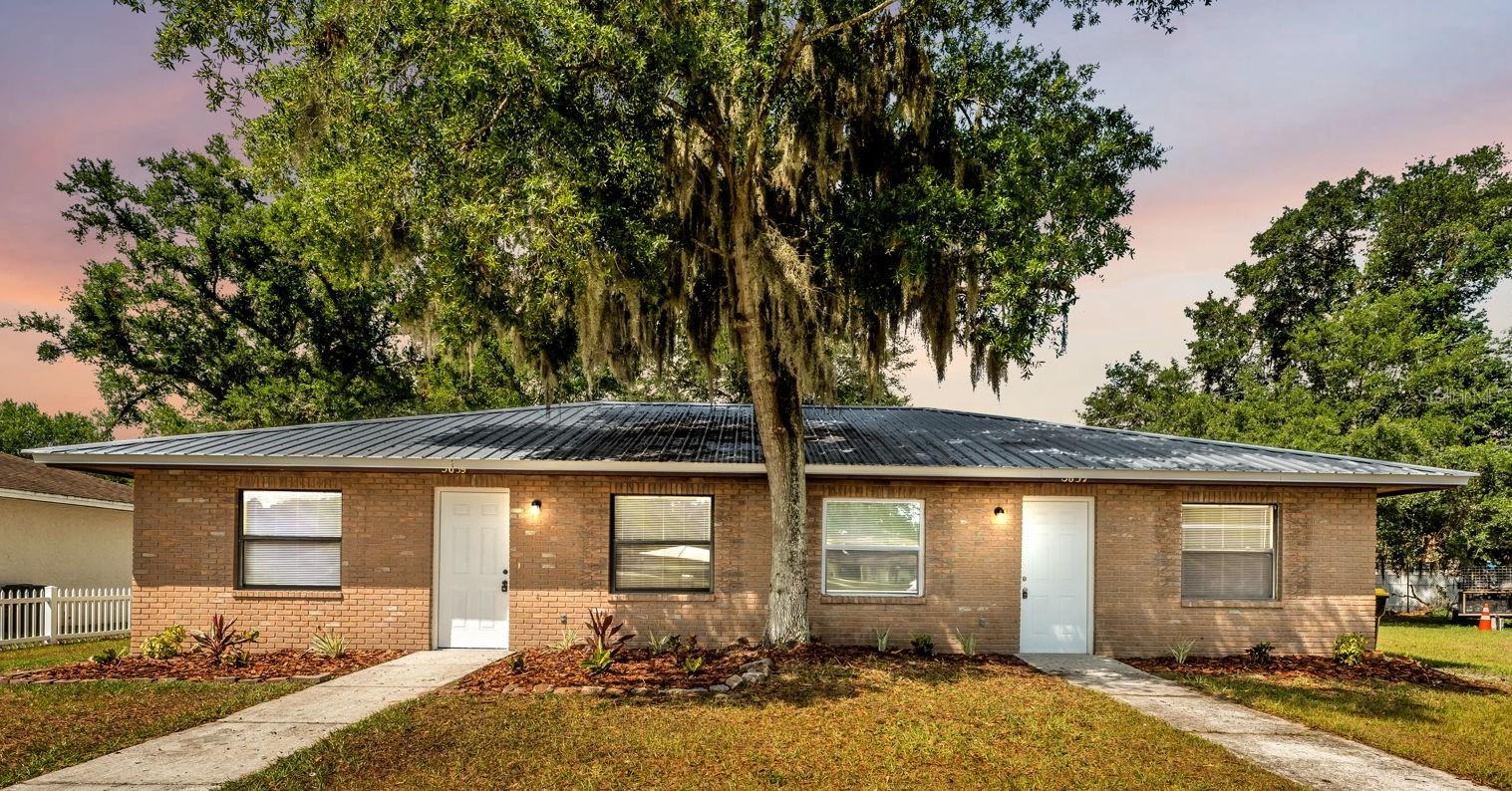 One or more photo(s) has been virtually staged. Investor opportunity in the heart of Lakeland! This well-maintained duplex at 5637 & 5639 Cherrywood Circle offers an excellent opportunity for both seasoned investors and owner-occupants looking to generate rental income. Both units are currently vacant to offer ease of showing.  Each side features 2 bedrooms, 1 bathroom, a spacious kitchen with ample cabinetry and prep space, tile flooring throughout for easy maintenance, updated lighting fixtures and ceiling fans.  The updated bathrooms, fresh interior and exterior paint provide a clean, modern feel throughout both units.  Situated on a large, oversized lot, the exterior offers updated landscaping, a durable metal roof, and additional storage rooms for each unit, adding extra functionality and value for tenants or owners alike. Conveniently located in Lakeland, this property provides quick access to shopping, dining, medical facilities, major roadways, and everything Central Florida has to offer. Enjoy proximity to downtown Lakeland, local parks, and nearby colleges including Florida Southern College and Southeastern University, making this an attractive location for long-term rental demand. Don’t miss your chance to own an income-producing property in a growing area of Central Florida!