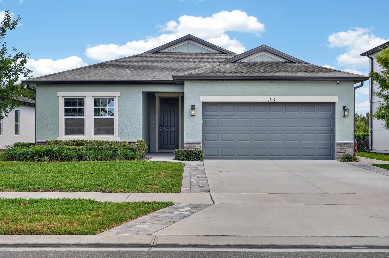 Welcome home to 1196 Pearl Tree Rd.

This 4-bedroom, 2-bath home built in 2023 has a layout that just makes sense for everyday living. The split floor plan gives everyone their own space, while the main living area stays open and connected so it still feels warm and easy to gather in.

The kitchen sits at the center of the home with stainless steel appliances, a large island for casual meals, and a walk-in pantry that keeps everything organized. The primary suite is tucked away for privacy and includes a walk-in closet and a beautifully finished bathroom with a soaking tub, separate shower, and private water closet. The additional bedrooms are flexible enough for guests, kids, or a home office setup.

Out back, the screened lanai and gazebo overlook a peaceful conservation area and lake view, giving you a quiet spot to unwind at the end of the day. Huge concrete pavers lead the way out to the gazebo, creating a clean, finished outdoor path, and the yard is set up for easy enjoyment and entertaining.

Extra touches include an extra wide driveway and an upgraded HVAC system for added comfort and efficiency.

Living in Deltona means you get a balance of convenience and space. You are close to everyday shopping and dining, plus major roads that make commuting simple. The area also offers nearby parks, sidewalks, and community spaces, along with easy access to Orlando and Florida beaches when you want a weekend getaway.

Move-in ready, modern, and set in a growing area that people are really starting to love. Schedule a private tour today!