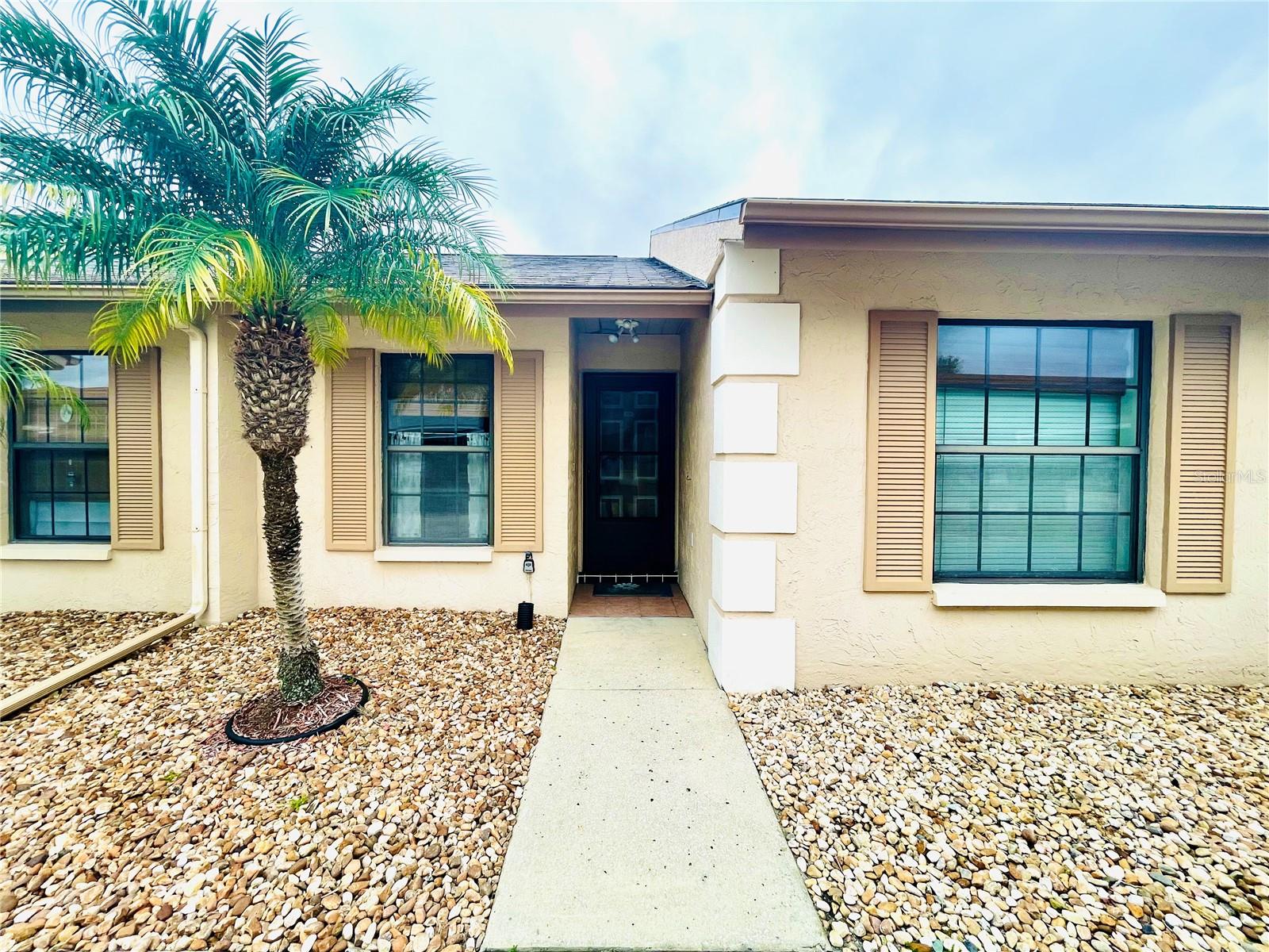 ***55+ COMMUNITY***  Great 2 Bedroom 2 Bath condo with Carport.  Bedroom two can be an office because Murphy Bed installed!  Engineered hard wood floors. Vaulted Ceilings. Open floorplan. Nice Patio. Right across the street from pool. This condo is a must see!