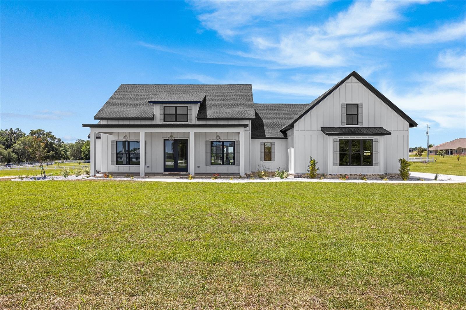 Pre-Construction. To be built. This elegant offering comes on 3.4, equestrian friendly acres in picturesque and convenient location. As you walk in the front you are welcomed by the stunning wood work on the foyer and dining walls. The open kitchen is truly stunning with flush custom cabinetry a large ten-foot island that looks amazing and is functional. The pantry will not disappoint with a sleek barn door and ample shelving. The family room is open and airy with plenty of natural lighting and boasts cathedral ceilings, a beautiful fireplace and built-in shelving. On one end of the split floor plan is two bedrooms and two full bathrooms, one of these rooms having a large walk-in closet and a full bathroom with a door that leads to the back patio. On the opposite end of the home is the primary suite with more eye-catching woodwork on the back wall and a barn door leading into the primary bathroom. This bathroom is elegantly done with ample functional storage. Off the bathroom is an amazing walk-in closet with built in shelving. Outside of the primary suite is a large laundry room with custom cabinetry and plenty of space.  A staircase by the back entry leads to a large bedroom/office/guest room/etc. This upstairs room has a full bathroom, a large closet, and pretty countryside views. This home is conveniently located just 10 minutes from your main stores, restaurants and shopping. *Photos are NOT the actual home, but a matching plan by the same builder, Sparks Construction, and represent the finishes offered.