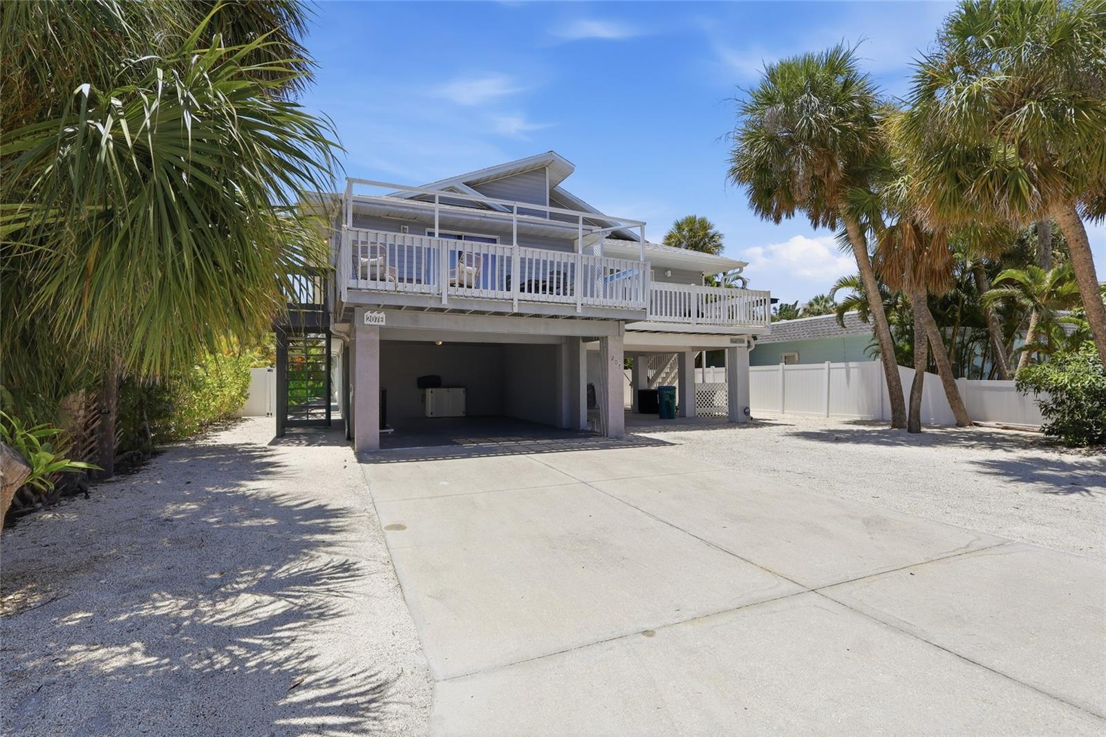 Interior photos coming soon! Location, location, location! Enjoy this elevated 2-bedroom 2 bath home located in central Holmes Beach on Anna Maria Island. You are three houses away from beach access and all of a 5 minute walk to watch sunsets and relax on the Gulf Beaches. This home has been renovated, and is turnkey furnished in a beachy décor to continue as a productive vacation rental or bring your things and move right in! The open floor plan includes a kitchen that opens to living room and dining area as well as the outside deck. The large 10x19 open front porch is perfect for entertaining with friends or family. The yard is low maintenance, and the back yard is completely fenced in with a brand-new heated swimming pool and turf. Downstairs is an open area that you can make into your own mancave or entertainment area. Ideas are unlimited. The location makes this home a perfect investment property.