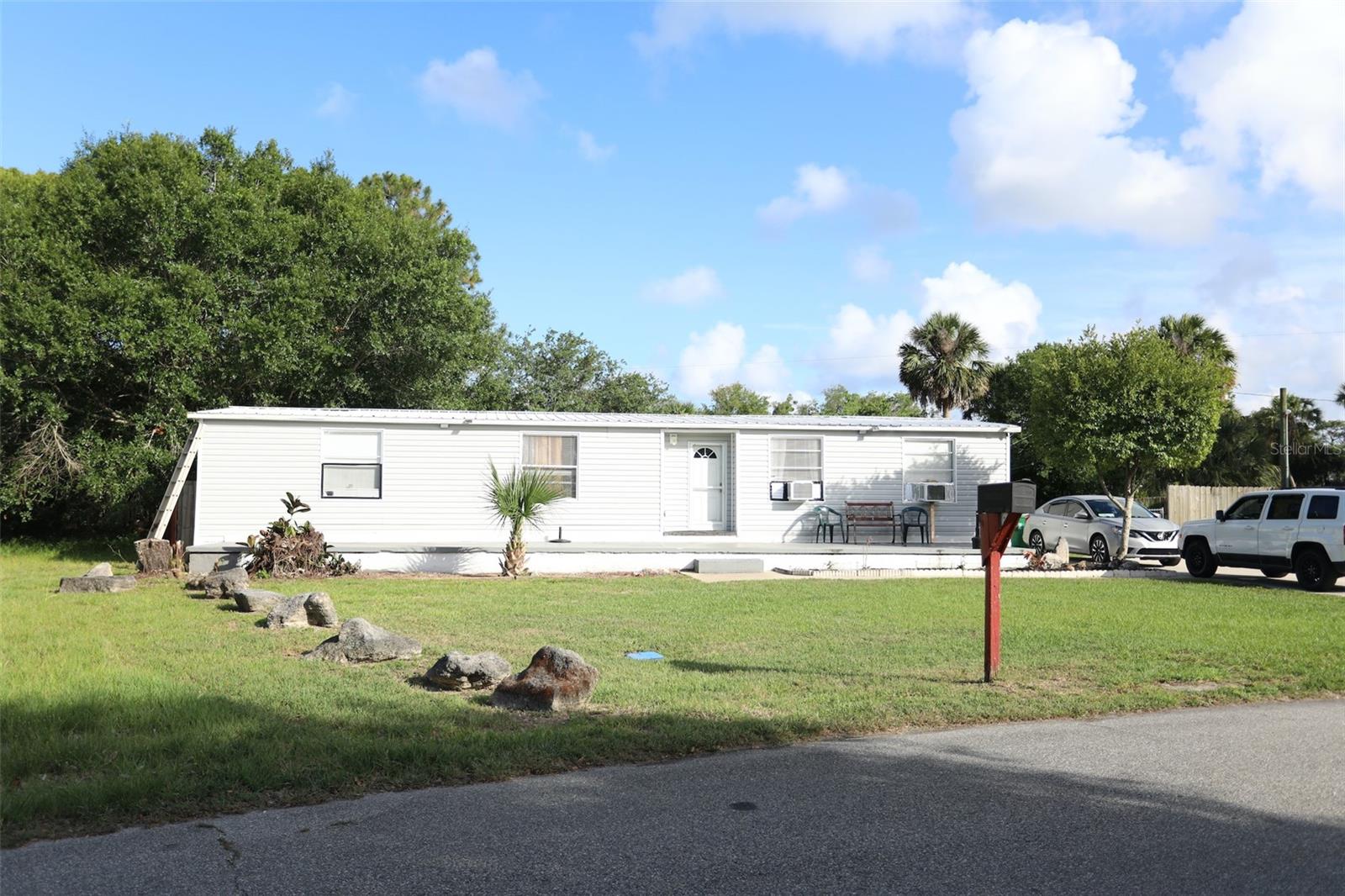 GREAT HOME CLOSE TO COCOA BEACH! NO HOA! You own your lot!  This great home is located on .27 acres OVERSIZED LOT. Features include OPEN FLOORPLAN with living room, dinette, SPACIOUS KITCHEN WITH EAT-IN ISLAND, and dining room.  SPLIT BEDROOMS with primary bedroom with EN-SUITE BATHROOM fully renovated and WALK-IN CLOSET.  The other two bedrooms share a RENOVATED HALL BATHROOM.  Enjoy the outdoors with OVERSIZED FENCED BACKYARD with THREE SHEDS for ample storage.  Septic tank emptied 2024. New TANKLESS WATER HEATER 2024.