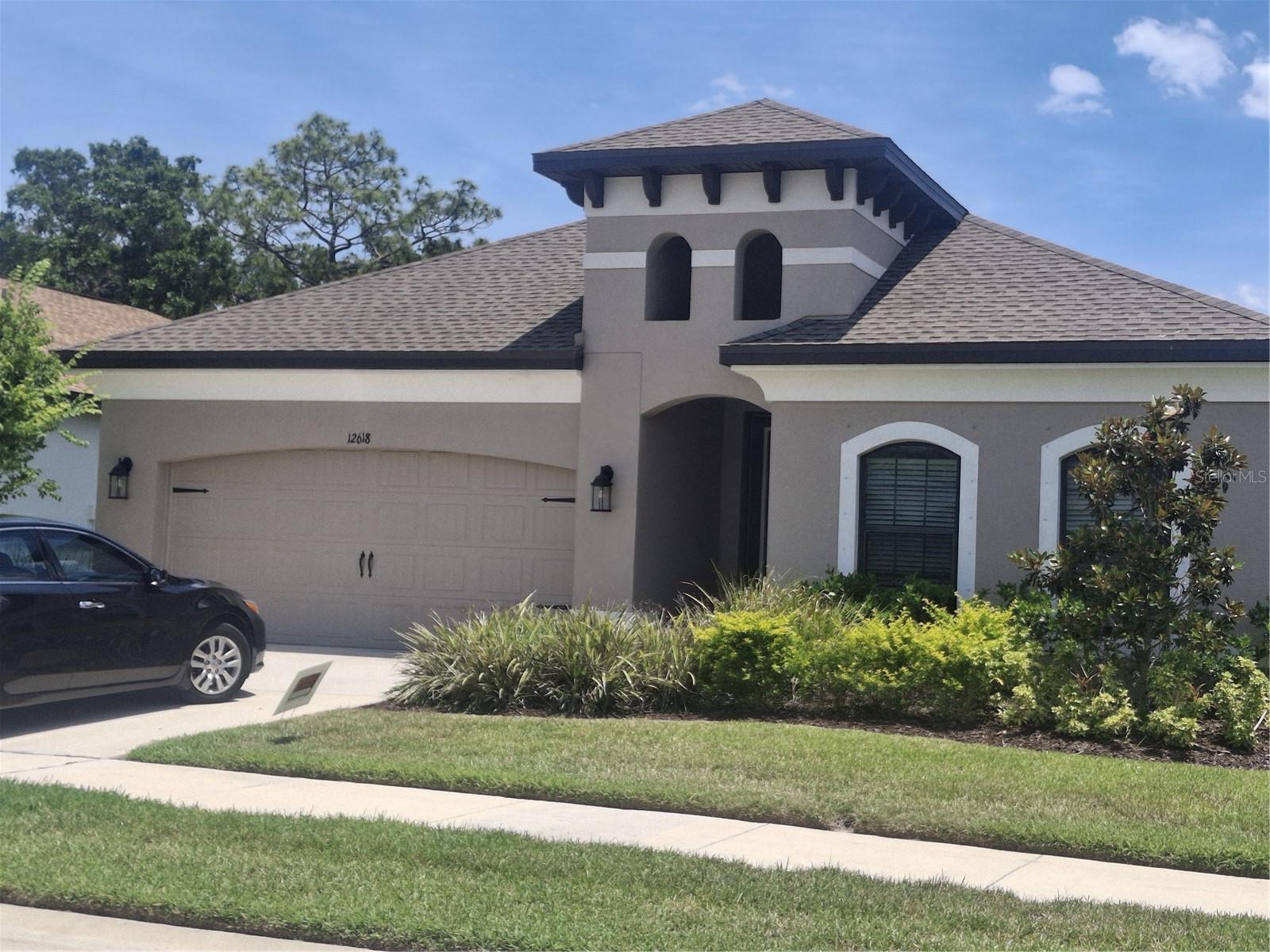 Beautiful 4-bedroom 3 full bath home including a 2- car garage located on a private Cul de sac in a secure gated community. Entry way includes a leaded glass front door leading into a grand entry way.  Kitchen includes large pantry beautiful white cabinets and quartz countertops.  Kitchen overlooks a spacious open floor plan with dining and family room.  Master bedroom includes upgraded tile in shower and quartz countertops.  Split bedroom plan with private 4th bedroom and bathroom perfect for guests.    Bedrooms 2 and 3 are spacious and share a third bathroom.  Luxury vinyl throughout the main living areas including kitchen.  Community pool with cabana and low HOA fees.