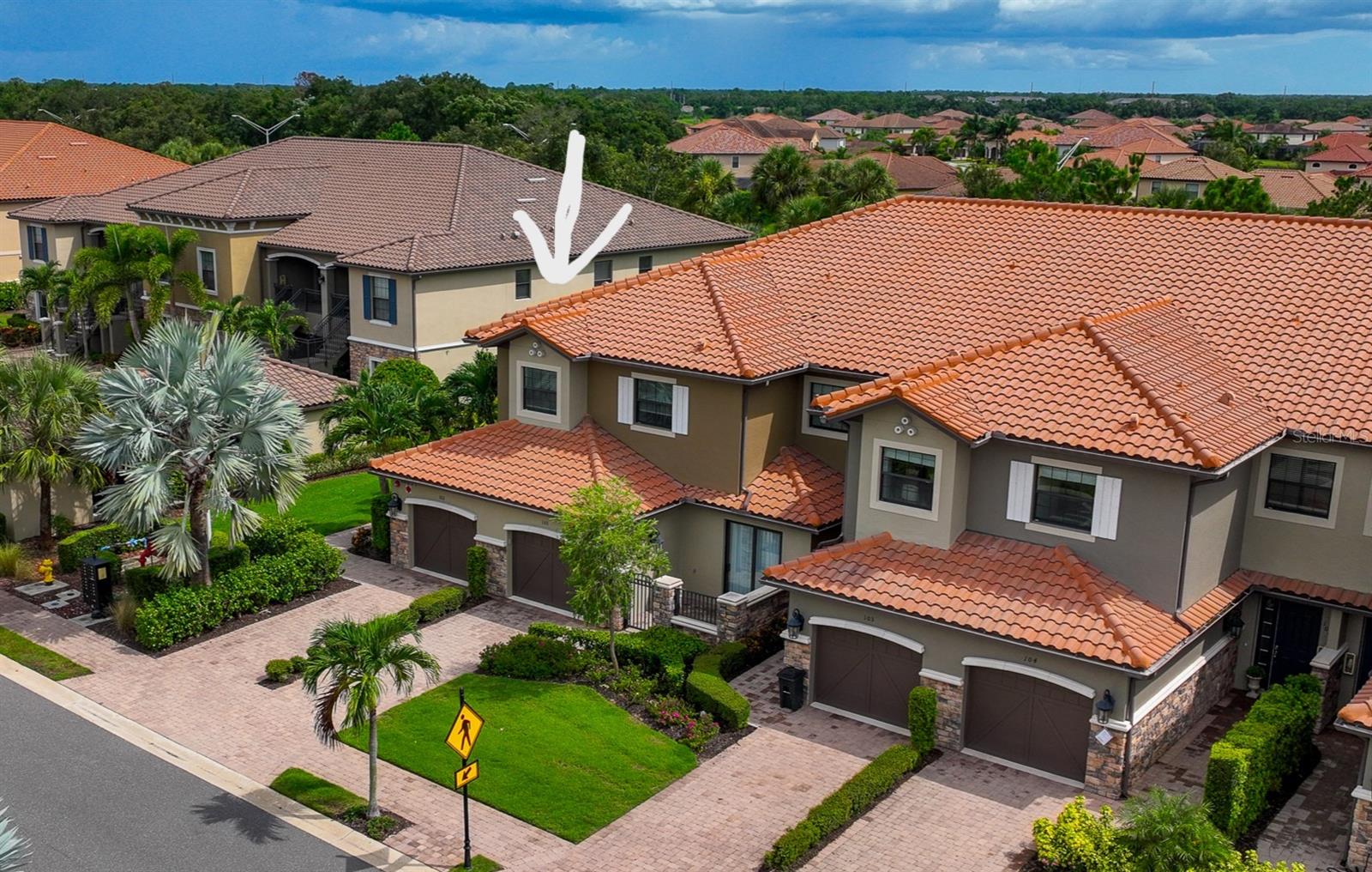 Guard, Gated, Golf & Tennis Community, Maintenance Free, 2184 Sq Ft, 3 BDs, 3 Full Baths, NON-GOLF membership, State of the art amenities, Only Corner Units have additional Windows & Corner Sliders on Lanai, Attached Garage, 12 Ft Trey Ceilings, Open Floor Plan, Luxury Amenities. This rarely available end-unit luxury coach home is located in the lavish, GUARD-GATED, MAINTENANCE-FREE GOLF community of Esplanade in Lakewood Ranch, feels and lives like a single-family home but with the convenience of a condo. Managed by TROON, this golfing community is enhanced by Cliff Drysdale Tennis, offering top-tier golf and tennis amenities. The END UNIT features additional square footage including 3 FULL BATHS instead of 2.5, abundant windows, and a large zero corner opening slider. Spanning 2184 Sq Ft on one floor, it includes 3 Bds and 3 Full Baths. Upon entering you will be captivated by the open floor plan featuring a sprawling great room with a cozy fireplace, custom built-ins, 12-foot tray ceilings, and plenty of natural light.  Large corner sliders (only available to the end units) open to a private screened lanai, perfect for relaxation.  Enjoy this luxury CHEF’S KITCHEN boasting solid wood Blanc cabinets, an EXTRA LARGE GRANITE ISLAND with a breakfast bar and STORAGE CABINETS both sides, and stainless – steel appliances. The owner’s suite offers a perfect retreat with ample space for a king-size bed and an ensuite bath with spa-like features, including dual granite sinks, an oversized walk-in shower with multiple heads including a rain hat, and a large walk-in closet.  The split bedroom design ensures privacy between the owner’s suite and the additional two bedrooms, one of which is an ensuite for guests welcoming them in true comfort. This home features 3 full bathrooms, a laundry rm w/ cabinetry and a sink for convenience, and an attached oversized one-car garage with space for storage.  The unit DOES NOT include a mandatory golf membership, not burdening the new owner with additional HOA fees, but the new owner can still enjoy the golf & and the community amenities.  This house includes the social membership to world class amenities including a private clubhouse overlooking the 18th green with restaurants, multiple resort style pools with spas a luxury full-service salon, an outdoor Bahama bar, a wellness center with state-of- the-art-gym equipment, 6 Har-Tru tennis courts, 8 pickleball courts, community interest groups, dance classes, walking trails, billiards, playgrounds, dog parks, and more.  Located in LWR, one of the fastest-growing, top rated communities in the US, this home offers luxury living near restaurants, shopping malls, entertainment, and beautiful beaches.  Call today for a private tour…