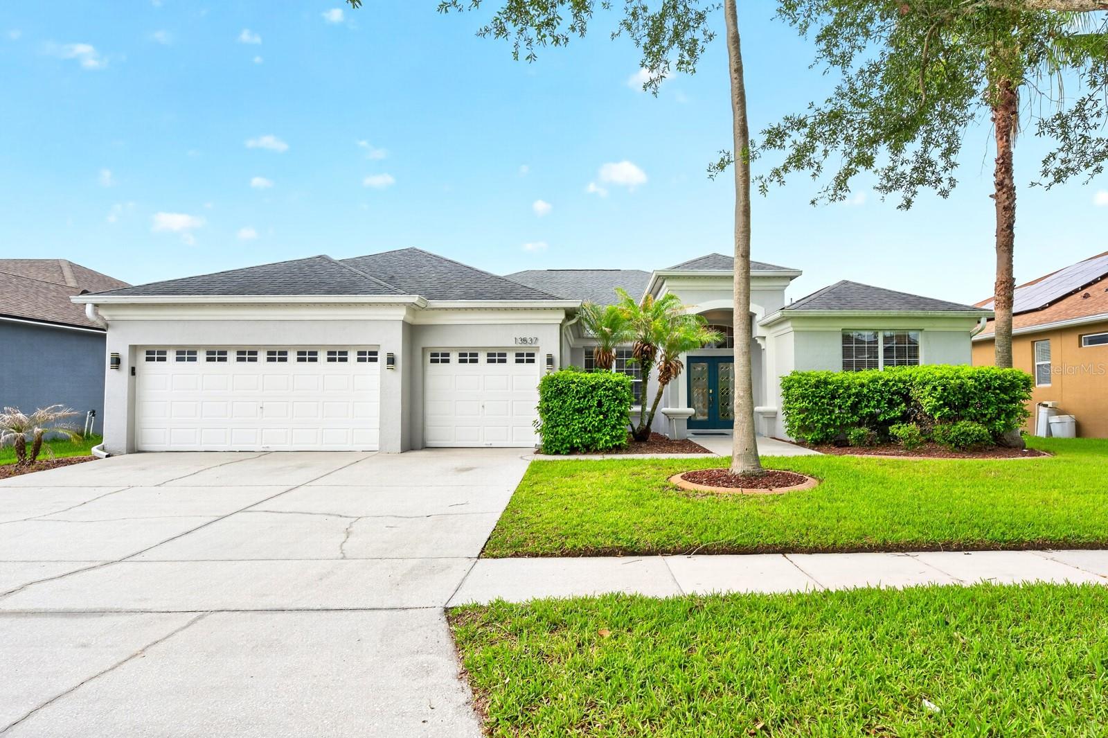 Virtually Staged. Spacious, versatile, and designed for the way you live! This 4-bedroom, 3-bath home with a 3-car garage in the desirable Bridge Water community offers an ideal single-story layout with room for everyone. Recent updates include a NEWER A/C (2023), while the roof and water heater were both updated in (2015), giving you added peace of mind. From the moment you arrive, you will appreciate the attractive CURB APPEAL, mature landscaping, covered front entry, and elegant glass inset DOUBLE FRONT ENTRY DOORS. Inside, HIGH CEILINGS and a thoughtful floor plan create an open, inviting feel with formal living and dining rooms, and a spacious family room for multiple flexible spaces to suit your lifestyle. The kitchen sits at the heart of the home and opens seamlessly to the family room and casual breakfast nook, making it perfect for everyday living and entertaining. Home chefs will love the STAINLESS STEEL APPLIANCES, breakfast bar seating, prep ISLAND, pantry storage, tiled backsplash, and abundant cabinet and counter space. The SPLIT BEDROOM design offers privacy and flexibility with the generous PRIMARY SUITE occupying its own wing of the home featuring NEW CARPET, an OVERSIZED WALK-IN CLOSET, and a well-appointed en-suite bath. On the opposite side, a second en-suite bedroom space creates the perfect setup for guests, multi-generational living, or an IN-LAW SUITE. Bedrooms three and four share access to a third full bath, providing plenty of room to grow. One of the standout features is the EXTENDED SCREENED & TILED LANAI, offering the ultimate indoor/outdoor lifestyle. With multiple access points and ample room for outdoor living, dining, and entertaining, this space is ready for gatherings, quiet mornings, and everything in between. Furniture is negotiable, making this opportunity even more appealing. Residents of Bridge Water enjoy a LOW HOA and convenient access to SR 408, SR 417, E Colonial Drive, Alafaya Trail, Research Parkway, Challenger Parkway, Lake Pickett, AdventHealth Waterford Lakes, Waterford Lakes Town Center, University of Central Florida, Valencia College, shopping, dining, entertainment, and so much more. Bridge Water is ready for its newest neighbor – could it be you? Call today to schedule your tour!
