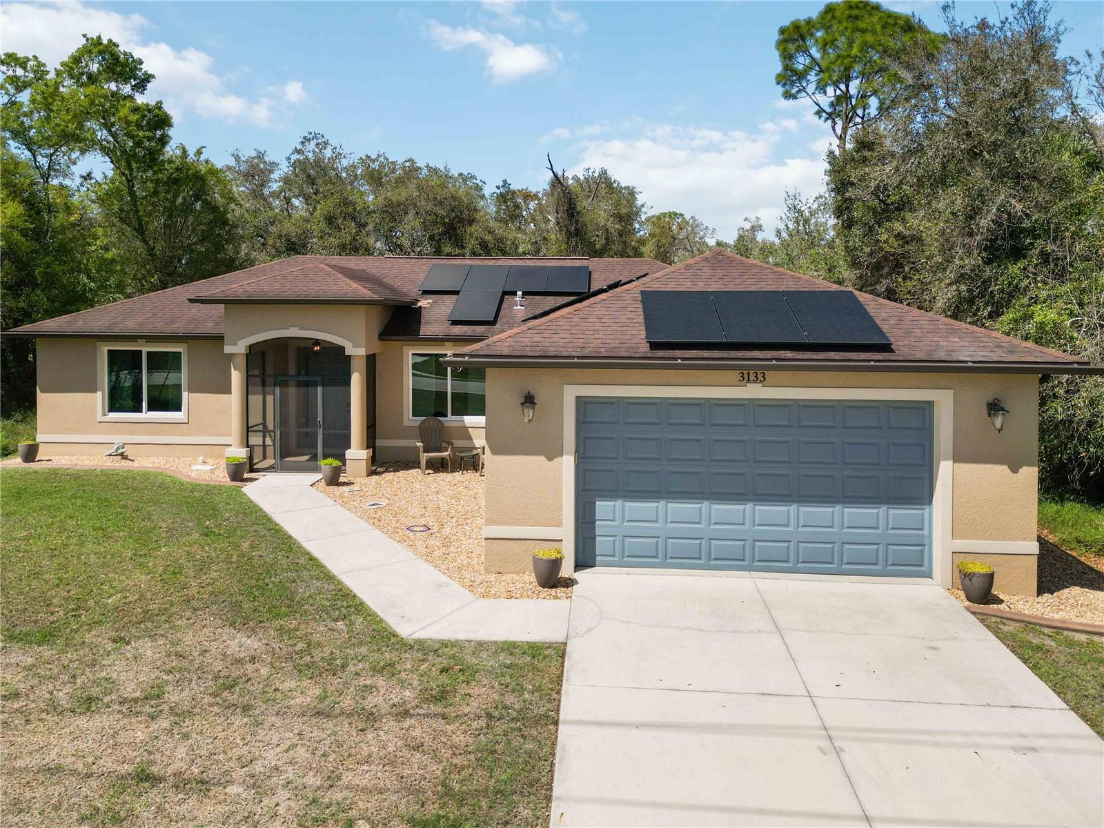 This home is not a cookie cutter new construction and here's some reasons why you should come take a closer look! IMPACT WINDOWS,DOORS AND SLIDER | TWO NEWLY REMODELED BATHROOMS FROM FLOOR TO CEILING WITH OVER SIZED SOAK TUB AND LARGE WALK IN SHOWER IN THE PRIMARY | 9 FOOT AND ABOVE TRAY CEILINGS THROUGHOUT | LARGE TILED AND SCREENED IN LANAI | HOME GENERATOR WITH EXTERIOR PLUG FOR CONNECTING TO IT | KINETICO WATER FILTRATION SYSTEM | NO HOA | NO FLOOD ZONE| ALL NEW LUXURY VINYL FLOORING IN MAIN LIVING SPACES INCLUDING BEDROOMS WITH NEW TILE FLOORING IN BATHROOMS | CUSTOM WOOD SHELVING IN CLOSETS AND PANTRY | ONE OWNER HOME ...THIS IS JUST TO NAME A FEW!

This CUSTOM like new home offers the kind of upgrades, efficiency, and peace of mind that truly set it apart! Built with more character and thoughtful detail than the typical new home, the interior immediately feels open and inviting thanks to high ceilings and upgraded 8 FOOT INTERIOR DOORS, complemented by elegant tray ceilings that add depth and style.The upgraded flooring that runs throughout the home, really creates a clean, modern look that is easy to maintain. The primary suite feels like a private retreat, with a beautifully and recently remodeled bathroom featuring an oversized SOAKING TUB and a large walk-in shower. 

The kitchen is designed for both everyday living and entertaining, featuring a large walk-in pantry with custom wood shelving that offers exceptional storage space, along with plenty of all-wood cabinetry and a great kitchen seating area with enough room for at least four bar stools. A BRAND NEW washer and dryer are also included with the home.This home features a newer solar system that is proven to keep electric costs predictable AND WILL SAVE YOU MONEY EVERY MONTH, dramatically reducing typical power bills while protecting you from future rate increases.

Outside you'll find a large, fully screened-in and tiled lanai—perfect for relaxing, entertaining, or simply enjoying the quiet of the extremely PRIVATE BACKYARD as well as mature landscaping and cement curbing around the landscaping beds and newly updated river rock creating a great accent to the perimeter of the home and enhances the curb appeal.

DID I MENTION THE LOCATION IS AMAZING, with the home conveniently situated near Coco Plum Village Shops, along with nearby top-rated schools, shopping, dining, and everyday conveniences. With major system upgrades already in place, energy-efficient living, privacy, and no HOA restrictions, this home offers a rare combination of comfort, freedom, and long-term value that is hard to find in today’s market. We welcome you to schedule a no-obligation showing and see firsthand if this beautiful home is the perfect place for you and your family.