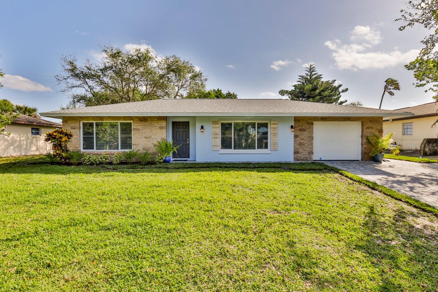 Completely renovated beachside home, located within walking distance to quiet, no drive beach. Driveway and walkways entirely replaced with pavers.  Roof replaced in 2018, HVAC replaced in 2019, high impact windows installed in 2018. New luxury vinyl tile flooring throughout the house, retextured walls and ceiling with   fresh paint, all new  interior doors with trim and base trim throughout. Crown molding adds finishing touch in all rooms. Bathrooms have new vanities, shower tile and tub.  Beautiful plantation shutters added to every window. Kitchen is updated with all new cabinets, subway tile backsplash, quartz counter top and all new appliances. Custom bedroom closets added. New French doors lead to back room enclosure with new epoxy finished flooring.     Transferable termite bond as well as hurricane panels for windows are an added bonus to this beachside gem. Bring your hammock  to this must see huge backyard with exotic banyan tree. ;Water: City