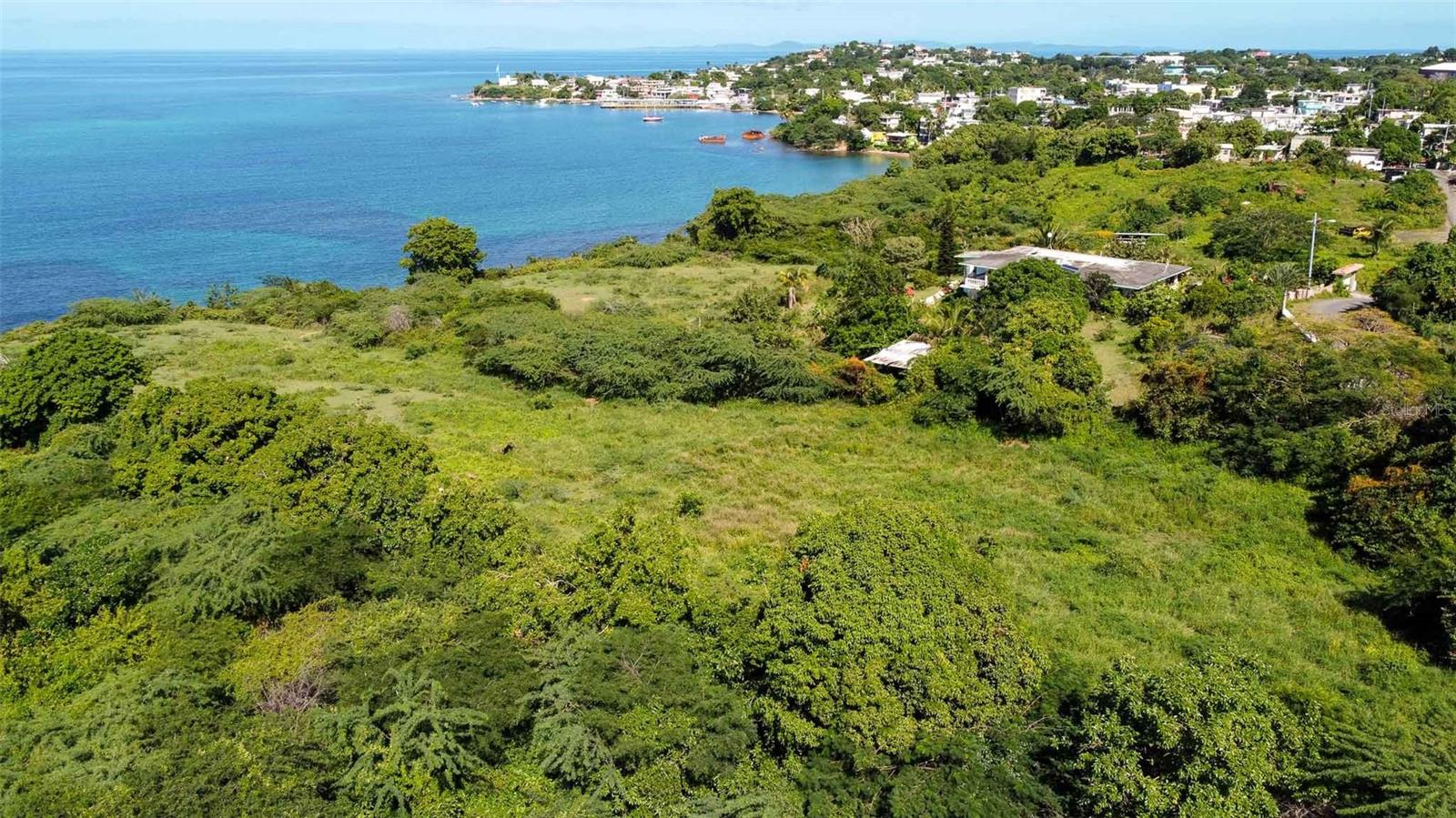 We are thrilled to present a unique opportunity to own a piece of paradise in the heart of the Caribbean. Our offering includes three buildable parcels on the mesmerizing island of Vieques, Puerto Rico, a gem in the Caribbean known for its vibrant Caribbean lifestyle and stunning natural beauty. There are 3 parcels that have been segregated in this area. This is known as Parcel #3. All three parcels are available for sale, and discount is available for the purchase of all three.

These exceptional Vieques properties are located within a mile of the bustling town of Isabel Segunda and a mere four miles from the Vieques International Airport. Whether you are seeking a secluded retreat or a place to immerse yourself in Caribbean life, these parcels provide the perfect foundation. Buyers have the option to purchase parcels individually or together as a package deal, offering flexibility to suit your vision of island living.

Each parcel boasts breathtaking panoramic views that encapsulate the essence of Caribbean living. Imagine waking up to vistas of the turquoise blue Caribbean Sea, gazing upon Vieques' sister island Culebra, the iconic Isabel Segunda Lighthouse, and the picturesque keys on the North side of Vieques. The mainland of Puerto Rico, including the majestic El Yunque rainforest, forms a stunning backdrop, enriching the scenic beauty. The daily ferry's journey to and from the mainland adds a dynamic element to the serene landscape.

The parcels are fully titled, ensuring a smooth transition to ownership. With utility connections for water and electricity nearby and paved road access, these parcels are ready to be transformed into your dream Vieques homes. Each parcel was approved for ARPE construction permits for a residential house, which along with architectural and engineering plans, paves the way for an effortless building process.

Nestled on the north shore of Vieques, just west of Isabel Segunda, these parcels offer waterfront access. This area between Isabel Segunda and the airport is witnessing significant development, with a variety of showcase homes already established and more underway. By investing now, you're not just buying property; you're securing a showcase piece of Paraiso in a rapidly developing area.

The topography of these parcels is as captivating as their location. They gently roll down towards the water, culminating in a small cliff that provides natural protection from the sea. This unique feature adds character to the land and offers numerous creative possibilities for designing your home.

Vieques is not just a location; it's a lifestyle. Beyond the stunning views and prime location, Vieques is renowned for its gorgeous beaches, exceptional restaurants, and the peaceful tranquility that permeates the island. The wild horses roaming freely add a touch of magic to the landscape, embodying the free-spirited nature of Vieques. A highlight of the island is the world-famous bioluminescent bay, known as the BioBay, a natural wonder that attracts visitors from around the globe.

These parcels are more than just real estate; they are a gateway to a dream Caribbean lifestyle. Whether you envision a private sanctuary or a luxurious estate, these properties in Vieques offer a canvas to bring your vision to life. Embrace the opportunity to be a part of this vibrant community and make your mark in the heart of the Caribbean.
