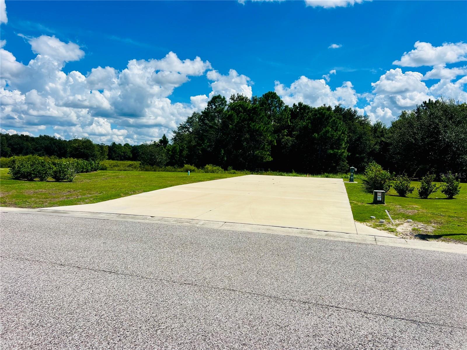 Just Reduced! Don't miss this opportunity! Lot 210 at Florida Grande Motor Coach Resort offers a 6,972 sq. ft. property in the resort’s sought-after new expansion. This spacious back-in lot features a 26’ x 76’ concrete pad with full hookups, including 50-amp electric, making it ideal for accommodating even the largest motorhomes. The lot is conveniently located near the dog park, perfect for owners traveling with furry friends. With plenty of room to add a 384 sq. ft. Grande Suite, the property offers flexibility to create additional living or guest space.

Florida Grande is a premier Class A and Super C gated motorhome community located in Webster, Florida—just an hour from Tampa, Orlando, and Ocala, and only 30 minutes from The Villages. Its central location makes it an accessible home base for easy day trips to many of Central Florida’s most popular destinations. Within the resort, owners enjoy a newly resurfaced pool, an impressive 20,000 sq. ft. clubhouse with fitness room, craft room, library, billiards, and more. Outdoor amenities include eight brand-new pickleball courts, horseshoes, and beautifully maintained grounds. The community is known for its welcoming atmosphere where neighbors quickly become friends, and the calendar is packed with regular activities and special events throughout the winter months.

HOA dues are $995 per quarter and include water, sewer, in-ground irrigation, trash service, mowing, trimming of boundary hedges, and full use of all resort amenities. Lot 210 is an excellent opportunity to join one of Florida’s friendliest motorhome communities and create your perfect home base for exploring all the Sunshine State has to offer.