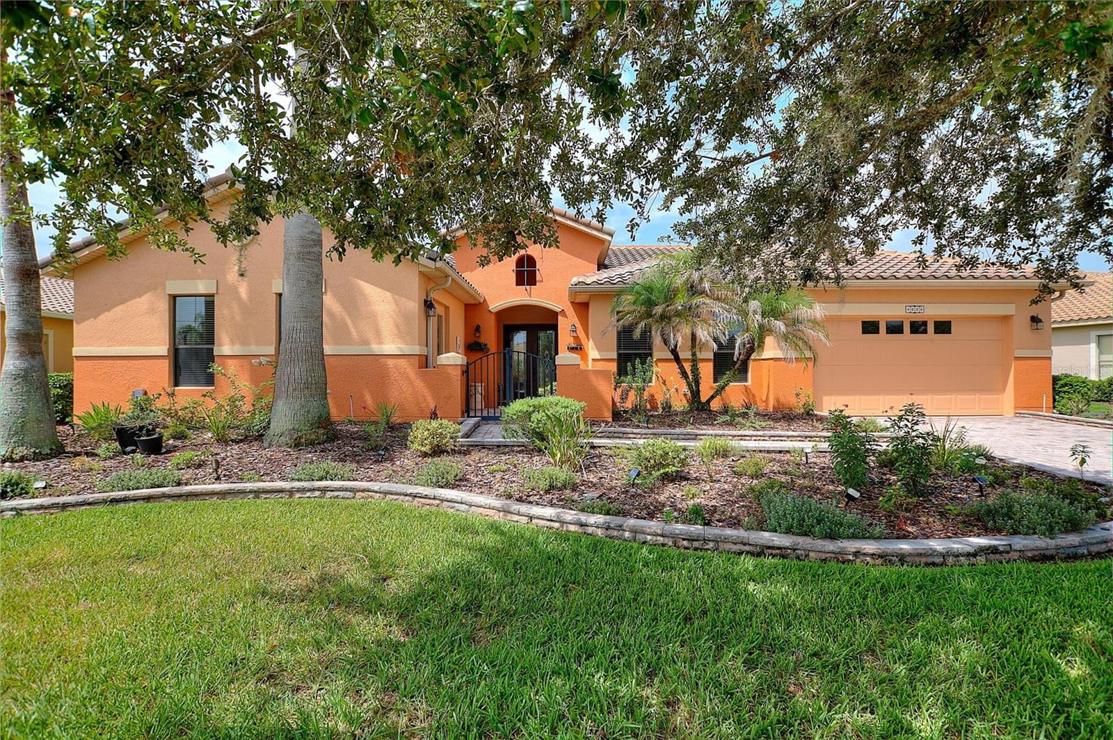 Discover luxury Solivita living at 915 San Raphael Street, a 3,110 square foot Biltmore model nestled in the highly desirable Portofino neighborhood.  With 4 bedrooms and 3 baths there is ample room for family and friends to visit, as well as the large bonus room that is ideal for an office, hobby room or (insert your ideal use here). As you approach the home and enter the gated courtyard you can't help but notice the impressive 8' leaded glass French Doors. Upon entering the home you are greeted with a living room with a 12' ceiling that is luxurious, yet warm and welcoming. As you glance to the right you see an extraordinary dining room with a coffered ceiling, where it is easy to imagine a relaxed dinner party with good friends. As you move into the kitchen, it is pleasing to the eye with warm toned 42" cabinets, granite countertops and stainless steel appliances. The kitchen is also a highly functional chef's delight with  a walk in pantry, double ovens, and a generous amount of counter space and cabinets . Rounding out the kitchen is a breakfast bar perfect for a quick bite to eat and a breakfast area with great views to the lanai and conservation beyond. Just beyond the kitchen is a Florida Room/Family Room with ceiling mounted surround speakers for immersive movie nights.  Next to the Florida Room is bedroom 2 featuring conservation views with an adjacent bathroom with quartz countertops and a jetted hydrotherapy walk in tub and shower combination. This bathroom has a door out to the lanai for easy access to guest gatherings in the lanai or, if a pool is added, a handy bathroom for pool users. Bedrooms 3 & 4 share a Jack and Jill full bathroom with quartz countertops and dual sinks. Entering the large primary bedroom suite you will notice the tray ceiling, separate sitting area with its own lighting and easy access to the lanai. Heading toward the en suite bath you will pass the two well sized   walk in closets. In the bathroom you will find Split Vanities each with its own sink, granite countertops, Garden Tub and recently upgraded (2026) frameless glass shower enclosure. Just down the hall from the primary suite is the bonus room with nearly 250 sqft of space and direct access to the front courtyard through French Doors. The expansive partially covered lanai with TILE floor is approximately 850 sqft and is ideal for both entertaining or enjoying your morning coffee while enjoying the peaceful conservation. Other notable features: 5.5" baseboards throughout, 12' Ceilings throughout the main living area and 10' ceilings in the rest of the home. Dual Pane windows with Norman 2" blinds throughout, Zoned HVAC replaced in 2021(unit 1) and 2022(unit 2), Professional landscape timed lighting, Ring Doorbell, Whole house multi-stage water softener and filter, epoxy flooring and built-in cabinets in the garage.  Arrange YOUR PRIVATE SHOWING of this outstanding home within Solivita’s dynamic 55+ community today! *PLEASE SEE THE MATTERPORT 3D VIRTUAL TOUR* With amenities such as 14 pools, 2 championship 18-hole golf courses, tennis, pickle-ball, basketball, softball, and over 240 clubs, plus two state-of-the-art exercise facilities spread across 4,200 acres of conservation, you'll have everything you need at your fingertips. HOA perks such as landscaping, irrigation, high-speed fiber internet, and streaming TV.  Please do not hesitate to schedule your tour of this MUST SEE home and perhaps make it YOUR new Solivita sanctuary!