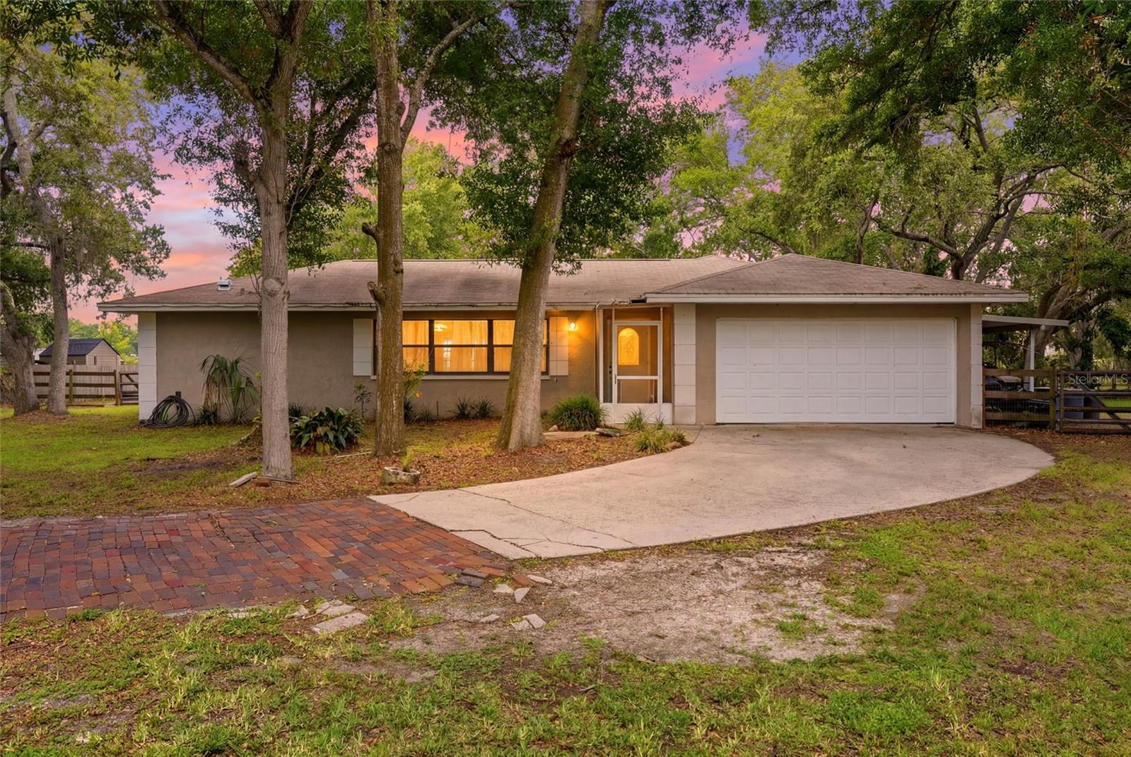 A rare opportunity to own acreage in the heart of Pinellas County! This 4-bedroom, 2-bath home offers over 2,000 square feet of living space on a beautiful, private property with endless possibilities. Whether you're looking for room to spread out, bring your horses, raise chickens or create your own private retreat, this property is one you won't want to miss.

The split-bedroom floor plan provides a great layout and is ready for your personal updates and finishing touches. Enjoy peaceful views of the wooded backyard featuring three separate fenced enclosures, with plenty of room to add a pool, horse stalls, gardens, or additional outdoor living space.

Horse lovers will appreciate the nearby equestrian trail with direct access to Lloyd Tingler Park, making this an ideal location for enjoying the outdoors. Need space for your RV, boat, trailers, or other toys? There's plenty of room with no shortage of parking options.

Experience the feel of country living while being just minutes from shopping, restaurants, major roadways, airports, and the beautiful Gulf beaches. Opportunities like this are incredibly rare in central Pinellas County, schedule your private showing today!
