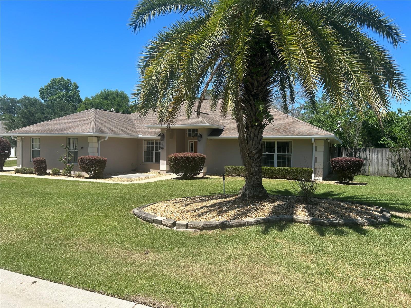 This home is a lovely 3/2 located in a highly desired and gated neighborhood! Walking into an open floor plan, the beautiful kitchen is a must see with its granite counter tops and convenient layout with an added bonus of a breakfast nook that overlooks a gorgeous, fenced in backyard. Large living area leads to a split floor plan that boasts tile and hardwood floors throughout. Master bedroom is spacious with a luxurious en suite, complete with large tub, separate shower and double vanity. Beautiful landscaping welcomes you to your new home, which is close to everything and is in a well sought after school district...Come see today!