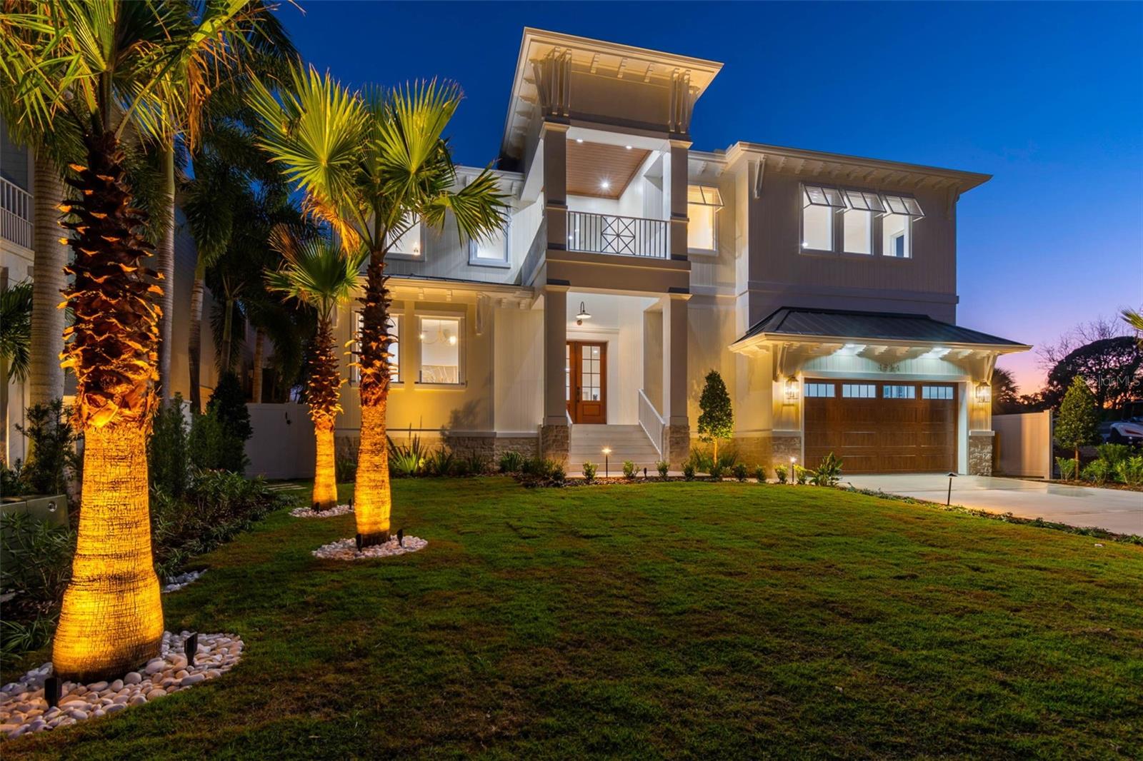 This exceptional coastal retreat brings refined waterfront living within reach. Thoughtfully
designed for gracious entertaining, comfortable everyday living, and effortless enjoyment
of the water, this light-filled residence makes a striking first impression with a dramatic 22-
foot front porch leading to a double-door entry and welcoming foyer. Just off the entrance,
a spacious private office provides an ideal work-from-home environment. Rich wood
flooring flows throughout the home, while the open-concept main level transitions
seamlessly from formal to informal living and dining spaces, creating a natural gathering
place for family and guests alike.
The gourmet kitchen is a true centerpiece, anchored by an impressive 12-foot island and
featuring custom cabinetry, a farmhouse sink, designer pendant lighting, and premium
Thermador appliances, including a six-burner gas range with pot filler. Exceptional storage
includes a generous walk-in pantry, abundant prep space, and a convenient secondary
washer/dryer hookup. A well-appointed mudroom with custom built-ins enhances
everyday functionality. Expansive sliding doors connect the main living area to a covered
porch and fully equipped Florida kitchen with sink, gas grill, and outdoor refrigerator—
perfect for seamless indoor-outdoor entertaining.
A first-floor guest suite with full bath and direct porch access offers privacy and flexibility
for visitors or multigenerational living. Upstairs, the sun-filled primary suite is a serene
retreat, highlighted by an extraordinary custom walk-in closet with built-ins and dedicated
makeup station, along with a spa-inspired bath featuring upgraded fixtures and lighting.
Three additional bedrooms are generously sized, each with ensuite baths showcasing
custom tilework, designer vanities, and walk-in closets. A large upstairs laundry room with
sink and custom storage accommodates even the busiest households. Completing the
upper level is a spacious bonus room—ideal as a media room, play space, or teen lounge.
Outdoors, the property delivers true resort-style living with a sparkling pool and spillover
spa, multiple covered areas for lounging and dining, and a private dock with davits for
paddleboards or jet skis—just moments from open Tampa Bay waters.