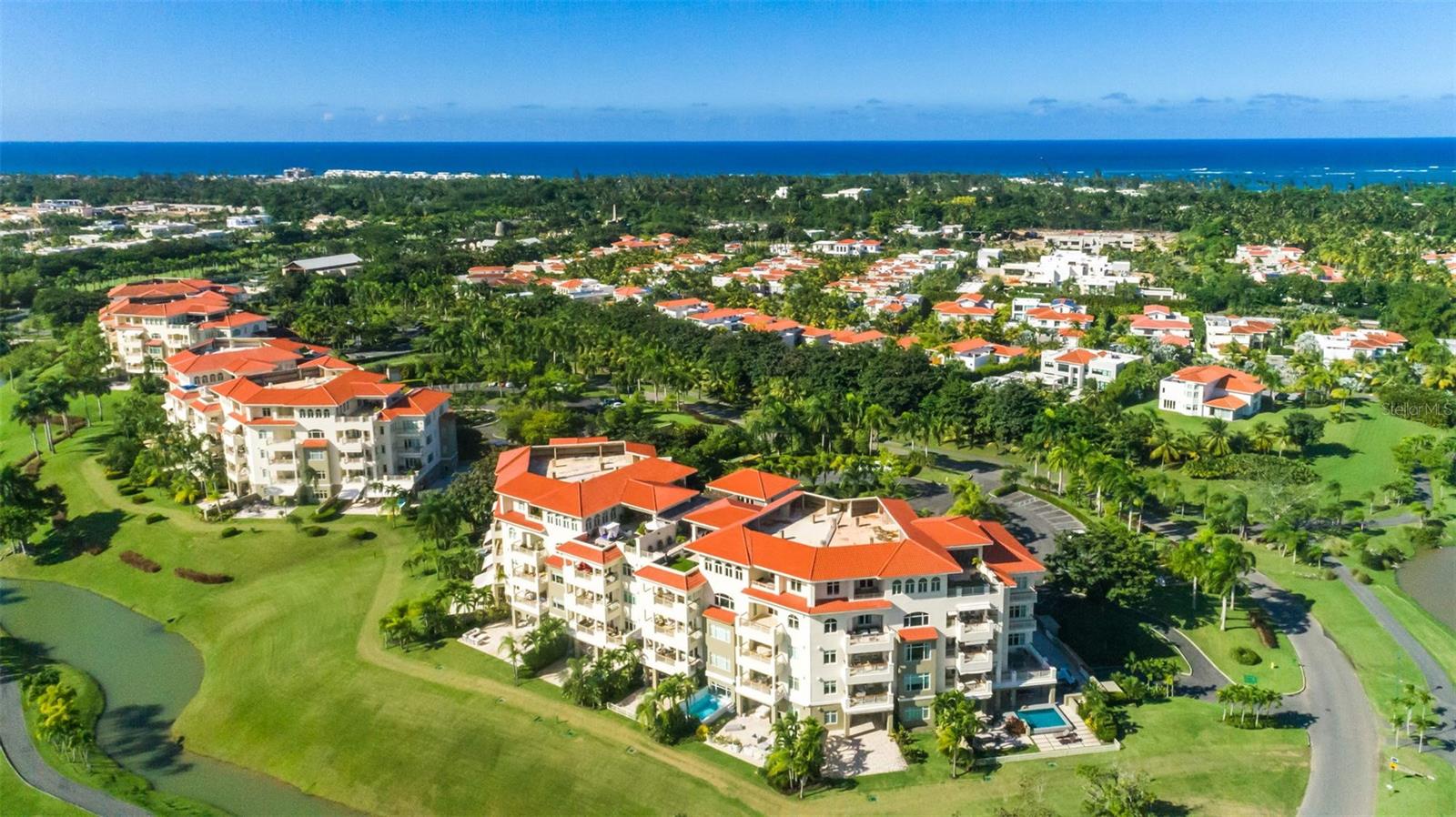 Exclusive Penthouse at Plantation Village, Dorado Beach

A rare and extraordinary opportunity to own one of the largest penthouses at Plantation Village within the Dorado Beach Ritz-Carlton Reserve Resort. This stunning two-level penthouse spans over 12,000 sq. ft., including 7,414 sq. ft. of luxurious wood and marble flooring interior space, complemented by 4,707 sq. ft. of expansive, covered and uncovered outdoor terraces offering sweeping views of the golf course and lush mountains.

Designed for grand-scale living and entertaining, the penthouse features six bedrooms, eight full bathrooms, and four powder rooms, all meticulously appointed with exceptional finishes and attention to detail.

On the first floor there are two bedrooms, four full bathrooms and two powder rooms. The second floor includes four bedrooms, four full bathrooms and two powder rooms. Vast windows adding natural light to shine through, furniture and accessories, thoughtfully conceived layouts and so much more making this remarkable residence an authentic gem. This residence was meticulously created with top-of-the-line finishes and custom details by renowned artist and designer Carlos Mercado-AD Studio Contemporary Art and Design.

The gourmet kitchen is a place where you can have the most intimate and memorable dining experiences with loved ones or special guests.

The fully equipped office room provides direct access to one of the terraces. Enjoy a nice workout in your home gym which includes equipment from Body Solid. Next to the fitness room is the entertainment room with a pool table by Olhausen, manufacturer of the best billiards in the USA. The private theater outfitted with plush upholstered seating, dramatic cove lighting to make viewing the large projection screens even more enjoyable, will be your preferred room whether you enjoy watching movies, a World Series Game, or the Super Bowl. The apartment has a full automations system including Lutron lighting and Sonos sound throughout.

The open and covered terraces are the highlight of this residence where you can entertain the family and friends or simply have a relaxing time enjoying the panoramic view.

For your convenience this property includes 4 garages for two cars including two oversized parking spaces right next to the elevator. In addition, there are two additional uncovered parking spaces for four vehicles parked back-to-back.

Plantation Village is located in the Dorado Beach Ritz Carlton Reserve Resort, at a short golf cart drive from the Beach Club, the Water Mill Park, Fitness Center, tennis and basketball courts, golf course and the Club House with its two renowned restaurants.

This Penthouse is offered fully furnished and equipped with top of the line appliances, commercial grade gym equipment, a $50,000 race car simulator and two Tomberlin golf carts.

For further details of this impressive residence please don’t miss the video walkthrough.

Experience the ultimate lifestyle, location, and luxury at Plantation Village-Dorado Beach!

Private showings are only by appointment.