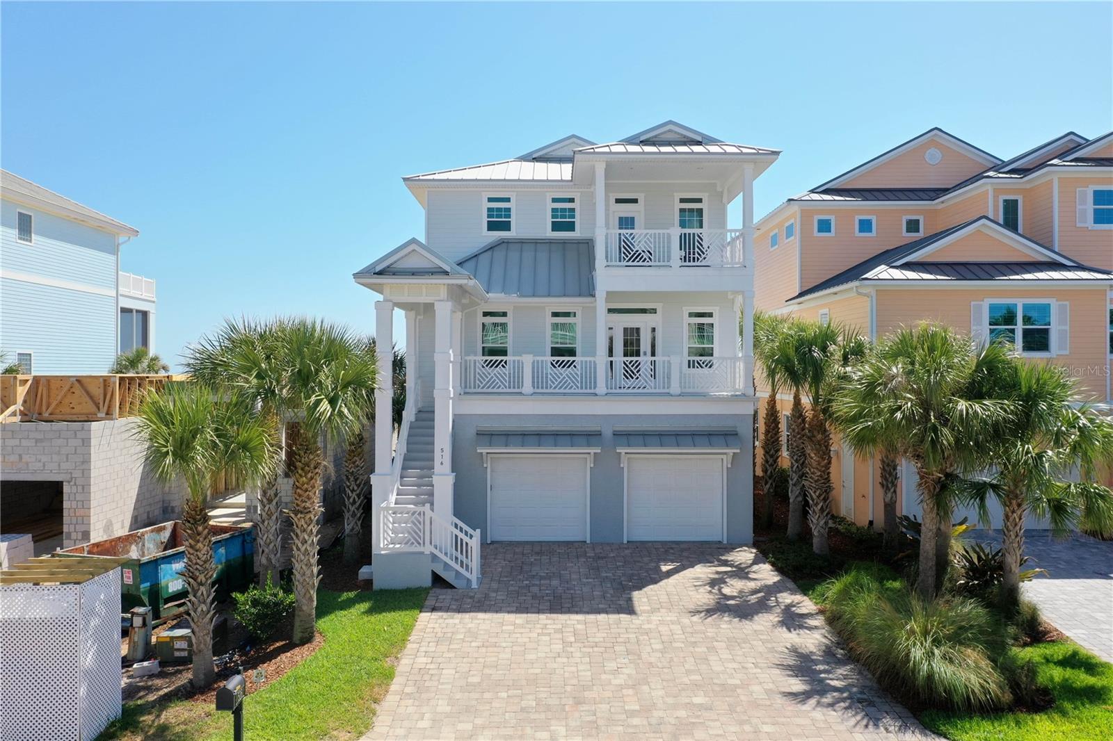 Incredible oceanfront dream pool home with attached spa and walkover to the beach is your next oasis!! This exquisite residence features three levels and jaw dropping ocean views from each!! The first level has a queen bedroom with en-suite full bathroom. Around the corner from the bedroom is the entertainment room with wet bar, gaming table and access to the pool area. 

Mosey up to the second level or take the elevator and you'll find the Oceanfront King Master Suite. This bedroom has an enormous picture window with stunning ocean views and a slider to the lanai. Where you can kick back, relax, watch and hear the waves lapping the ocean. Don't forget to catch the breathtaking sunrises over the Atlantic! The other four bedrooms also reside on this level offering privacy from the third level main living space.

Speaking of the third level, this is where it all comes together and flows with mind cleansing ocean view harmonies! The 'wall of windows and sliders' makes you feel just a step from touching the water!! The open kitchen concept brings family and friends together to share memories for a lifetime! This space also has another oceanfront lanai. Time it right and you may catch the right whales making their passage to warmer waters!! 

Step outside and take a swim in the modern heated pool and spa or soak up the rays on the pool deck. When it's time to hit the surf and sand the private beach crossover is just a few steps away! 

Upgraded HVACS in 2021 featuring mechanical air filter and UV lights for pure clean air. New 80 gallon hot water heater in 2022. 
Home is offered fully furnished minus a few personal items. 

Take advantage of all the amenities Cinnamon Beach has to offer including oceanfront and club pools, two spas, bar/grille, fitness center, game room, entertainment lounge all within a short walk of the home. 

Tour this lovely home soon, it won't last !!