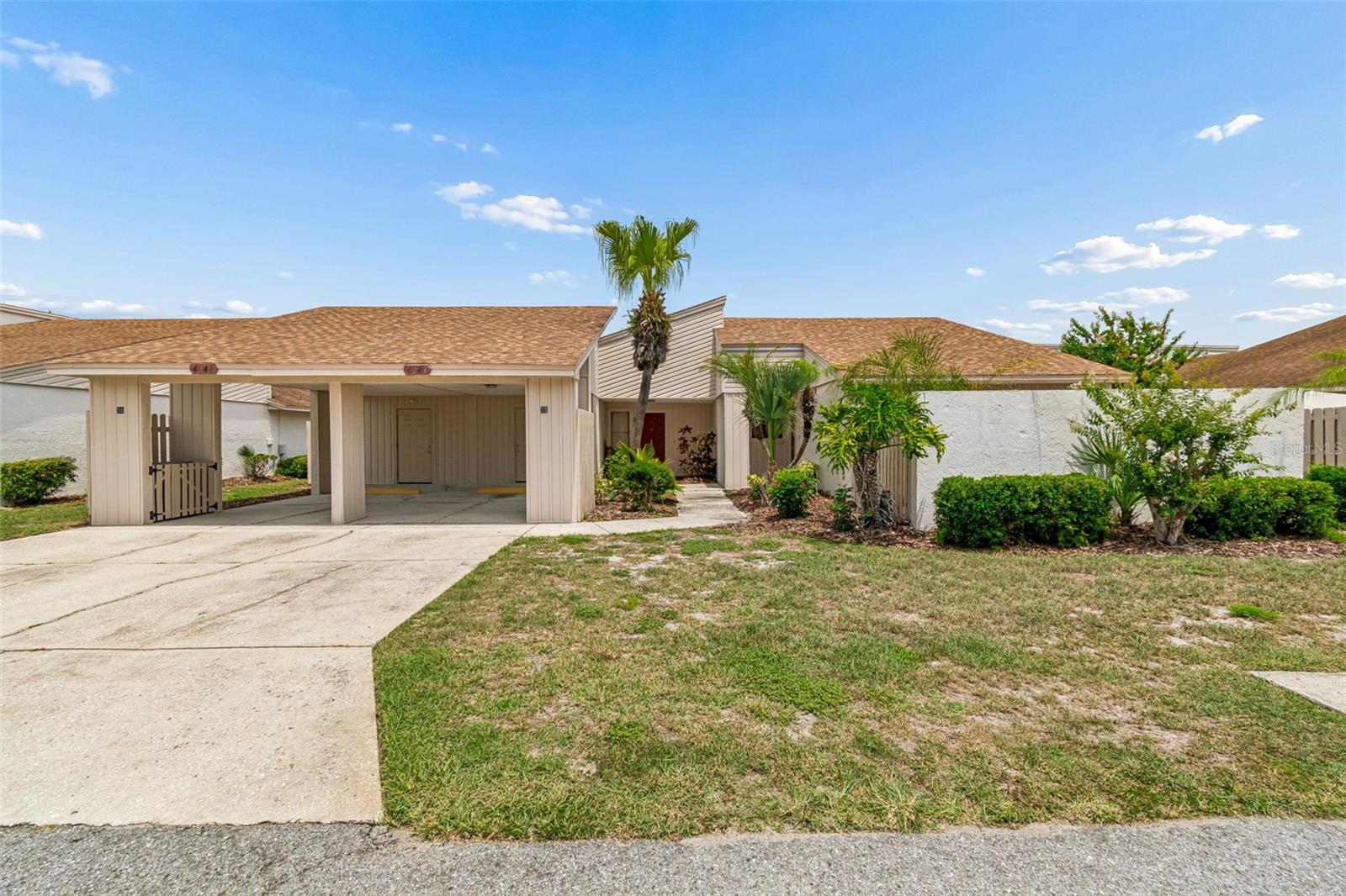 Stylish and move-in ready 2BR/2BA condo in the sought-after Meadow Oaks community of Imperial Lakes! This bright, open-concept space features soaring vaulted ceilings, a spacious living/dining combo, and oversized sliders that flood the space with natural light and lead to a private patio—perfect for morning coffee or evening unwind. 
The functional kitchen opens seamlessly to the living area with a breakfast bar, neutral appliances, and modern lighting, ideal for both everyday living and entertaining. The primary suite offers a walk-in closet, dual vanities, and a full bath, plus direct access to its own private fenced patio—your own peaceful retreat. 
Additional highlights include new AC and roof (2023), new water heater (2026), in-unit laundry, and assigned parking. 
Enjoy true maintenance-free living with HOA covering exterior upkeep, cable, internet, and more, along with access to a heated community pool and clubhouse in a quiet, well-maintained neighborhood. 
A perfect blend of comfort, convenience, and Florida lifestyle—don’t miss this one!
