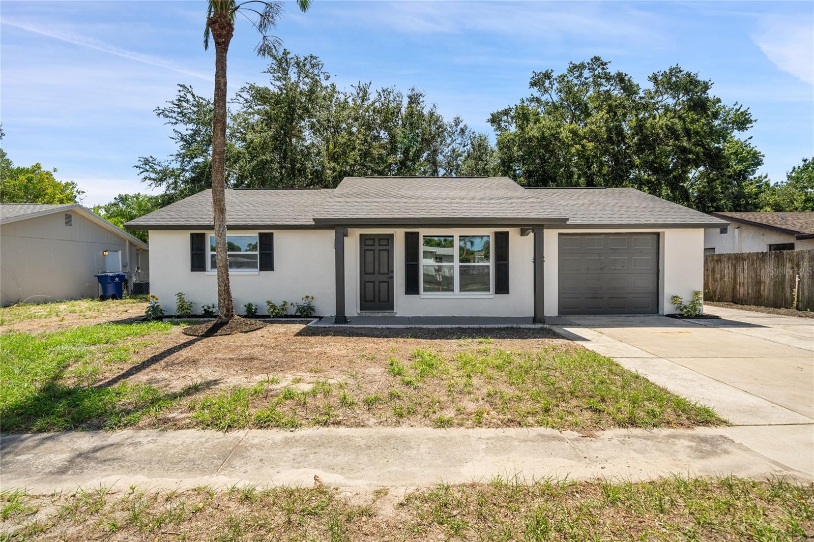 Completely renovated and move-in ready! Everything is done with permits and by the codes. This beautifully updated 3-bedroom, 1-bath home features a brand-new roof, new HVAC system, impact-rated hurricane windows, new electrical panel, new luxury vinyl flooring, designer lighting, and fresh interior and exterior paint. The open-concept floor plan offers vaulted ceilings and a stunning custom feature wall that creates a modern, upscale feel throughout the main living area. The kitchen has been completely redesigned with quartz countertops, custom cabinetry, decorative tile backsplash, brand new stainless steel appliances, and a large breakfast bar perfect for entertaining. The fully remodeled bathroom showcases oversized porcelain tile, frameless glass shower enclosure, premium fixtures, and contemporary finishes.
Additional features include an attached one-car garage, fenced backyard, updated landscaping, and a spacious lot with room to personalize. Conveniently located near shopping centers, restaurants, schools, medical facilities, parks, and Gulf Coast beaches.
Seller offering up to $5,000 toward buyer closing costs or interest rate buy-down.  Schedule your private showing today.
