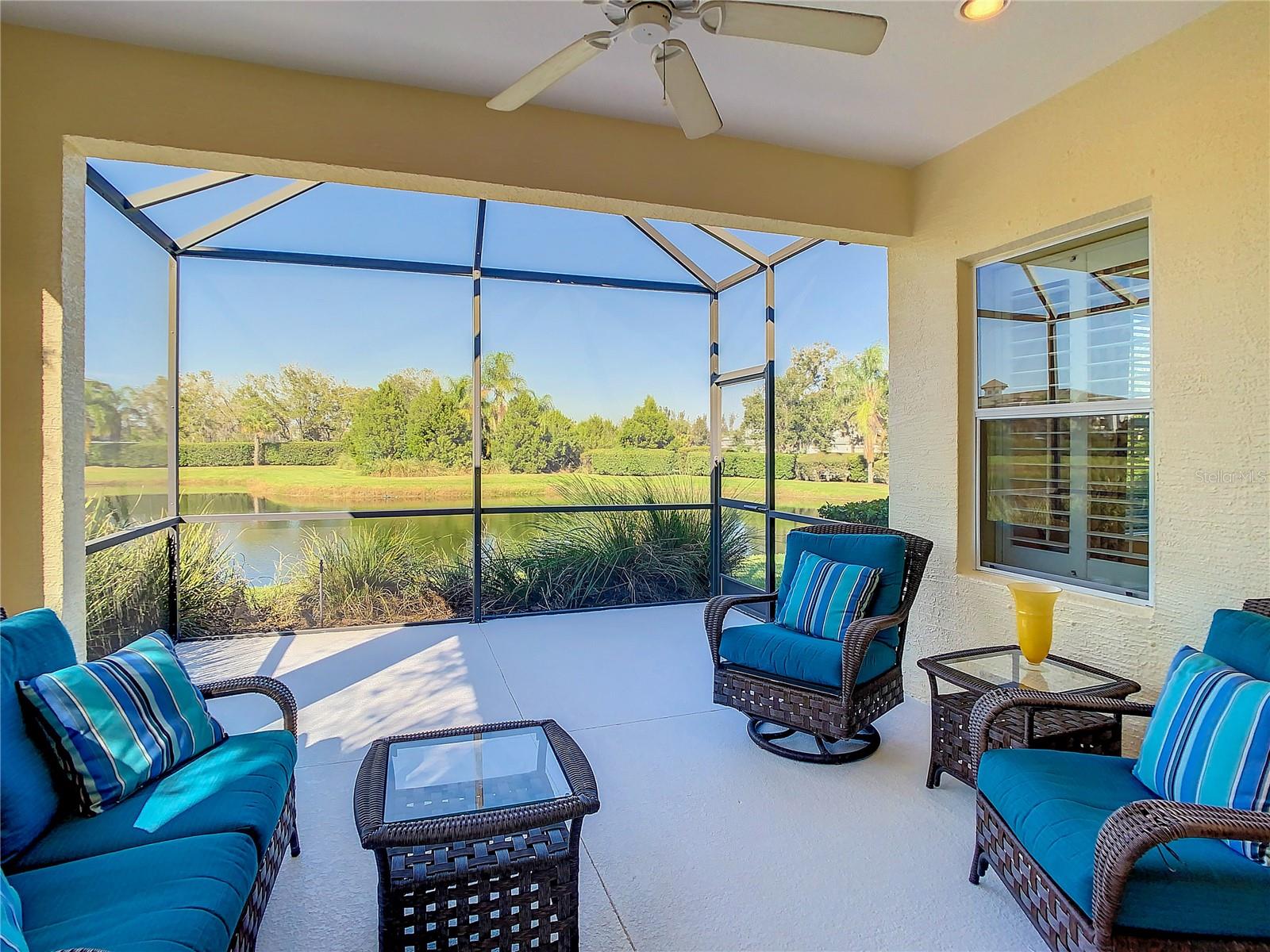 Not just another Eagle Trace villa.  Everyday living is a delight in this FORMER MODEL home with a WATER VIEW.  Beautiful MOVE-IN READY home in a GATED community. Detailed finishes abound.  Recessed lighting in each room.  Optional Architectural trim finishes off the look.   Lovely, high-quality window treatments complement the color palette and décor. Like what you see?  Furnishings available for sale on a separate contract making it super easy to begin your next chapter now.  TRAY CEILING with RECESSED LIGHTING in the Great Room adds to that spacious feel offering plenty of light. Upgraded Kitchen with STAINLESS STEEL Appliances and GRANITE counters and attractive BACKSPLASH. You will enjoy cooking with the GAS stove.  The POCKET SLIDERS bring the outdoors in. They open to the EXTENDED LANAI and create a wonderful OUTDOOR LIVING SPACE with plenty of room to grill and dine and lounge while soaking up the beautiful Florida weather. Split-bedroom plan offers privacy for you and your guests. EXTERIOR PAINTED and Pressure-washed, October 2023. Basic GROUND MAINTENANCE INCLUDED in the low quarterly fee so you can spend your leisure time sitting by the POOL or relaxing in the SPA. Very PET-FRIENDLY community with TWO (2) Dog Parks for your favorite furry friends. Home is an easy walk to the community amenities including TENNIS and PICKLEBALL; plus a PLAYGROUND for outdoor fun!  NO CCD fees with all the advantages of proximity to Lakewood Ranch. Nearby parks, walking and biking trails, shopping and dining. Plus, gorgeous beaches along the coast. The BEST OF EVERYTHING! Looking for easy, pleasant Florida living? Here it is!
