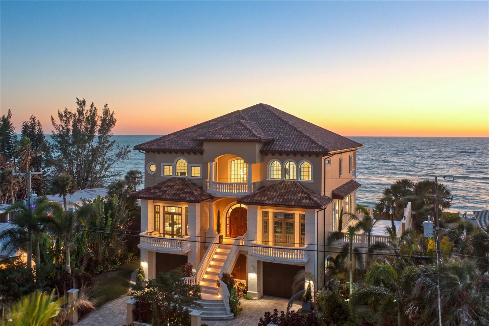Auction Property. AUCTION BIDDING OPEN: Bidding ends 6/26. Previously listed at $6.445M. Current high bid $4M. 

An architectural masterpiece awaits on Casey Key, where traditional Gulf Coast charm meets bold contemporary design in this magnificent 2018-built waterfront estate. Spanning 6,335 square feet of refined living space, the residence captivates with soaring ceilings and dramatic walls of glass framing endless Gulf of Mexico panoramas and spectacular sunset vistas. Meticulously crafted for seamless indoor-outdoor living, the open-concept interior flows effortlessly to expansive terraces and an infinity-edge pool overlooking tranquil waters. The gourmet kitchen showcases premium Italian Cucina cabinetry, sophisticated Dekton countertops, and professional-grade Miele and Bosch appliances. Four luxurious bedroom suites provide sumptuous accommodations, while a state-of-the-art media room, elegant gas fireplace, and comprehensive Crestron home automation system elevate the living experience. This extraordinary property represents the pinnacle of Gulf Coast luxury, offering discerning buyers an unparalleled opportunity to embrace the coveted Casey Key lifestyle in absolute comfort and style.