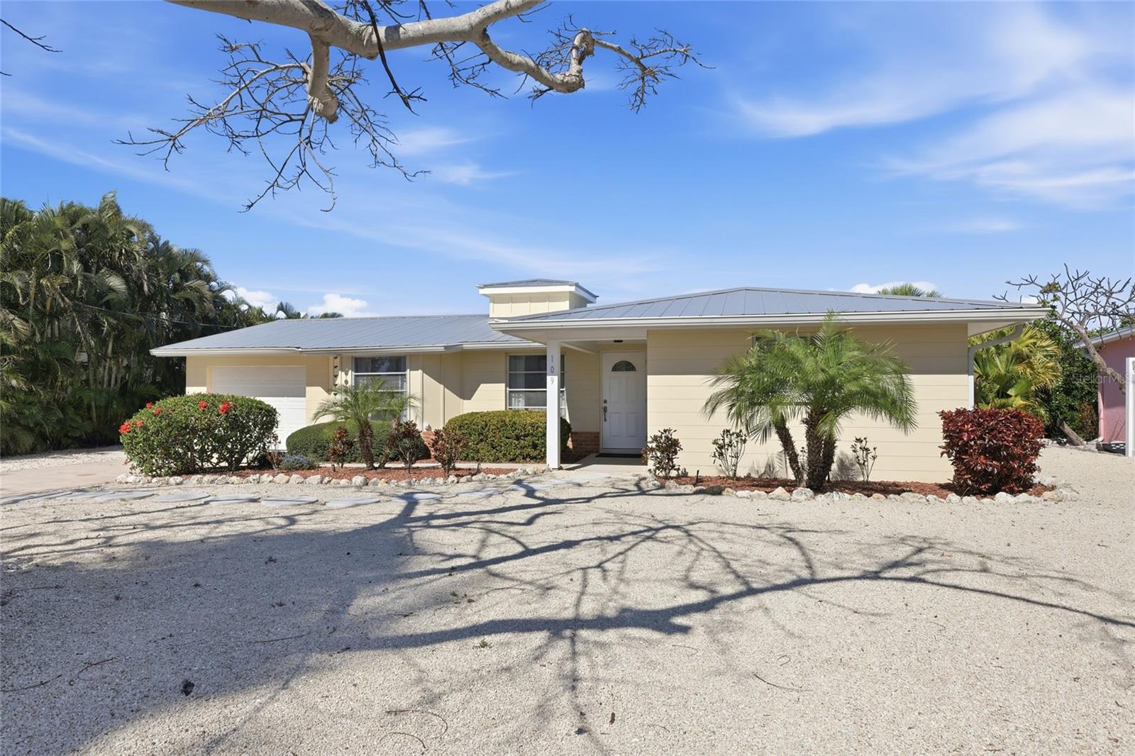 Love the beach and love to boat?  Delightful waterfront home with direct access to open water. Located on the famed North end of Anna Maria Island.  This 2 bedroom 2 bathroom home offers incredible opportunities for adventure.  Whether it is the sand of the Gulf beaches you seek or if enjoying the water from a boat, kayak, or paddle board is your thing the choice is yours.  Another incredible benefit of this location is the proximity to Pine Ave, full of fun shopping and eateries.  Generously sized lot is positioned on a cul-de-sac providing privacy due to no through traffic.  Concrete block paired with a metal roof creates a formidable structure.  As you enter the home you will be welcomed by a sense of coziness.  The kitchen features solid wood cabinetry and exquisite Taj Mahal quartzite countertops.  Entertaining is aided by the in-ceiling home speaker system.  Enjoy year around serene water views from the 300 square foot screened-in lanai equipped with four ceiling fans.  Single car garage for all your storage needs or get creative for a possible third bedroom.  The large lot leaves ample room for a pool to the front of the house.  Schedule a showing today and discover if this piece of paradise if right for you.