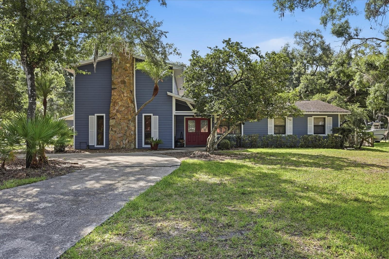 Tucked away on over an acre in the highly desirable Braden Pines community, this 5-bedroom, 3-bath pool home offers the space, character, and privacy that are becoming increasingly difficult to find. From the moment you step inside, you'll notice this home is anything but ordinary. You're welcomed by a spacious flex room that immediately showcases the charm and personality of the home while offering endless possibilities to fit your lifestyle. At the heart of the home, the fully updated kitchen features custom built-ins, modern finishes, and plenty of space to gather, making it the perfect place for everything from busy mornings to hosting family and friends. Just beyond, the living room invites you to slow down and relax with a beautiful wood-burning fireplace that creates a warm and inviting atmosphere. The thoughtfully designed layout provides room for everyone, while the upstairs primary suite offers a true retreat. Imagine starting your day with a cup of coffee or winding down in the evening on your private balcony overlooking the sparkling pool and expansive backyard. Braden Pines is known for its mature trees, spacious properties, and convenient location just minutes from Lakewood Ranch. Residents enjoy easy access to Lakewood Ranch Main Street, Waterside Place, UTC shopping and dining, top-rated golf courses, and I-75, making commuting to Sarasota, St. Petersburg, or Tampa a breeze. It's a rare opportunity to enjoy the privacy of country-style living without sacrificing proximity to some of the area's best restaurants, shopping, entertainment, and recreation. Schedule your private showing today before this incredible opportunity is gone!