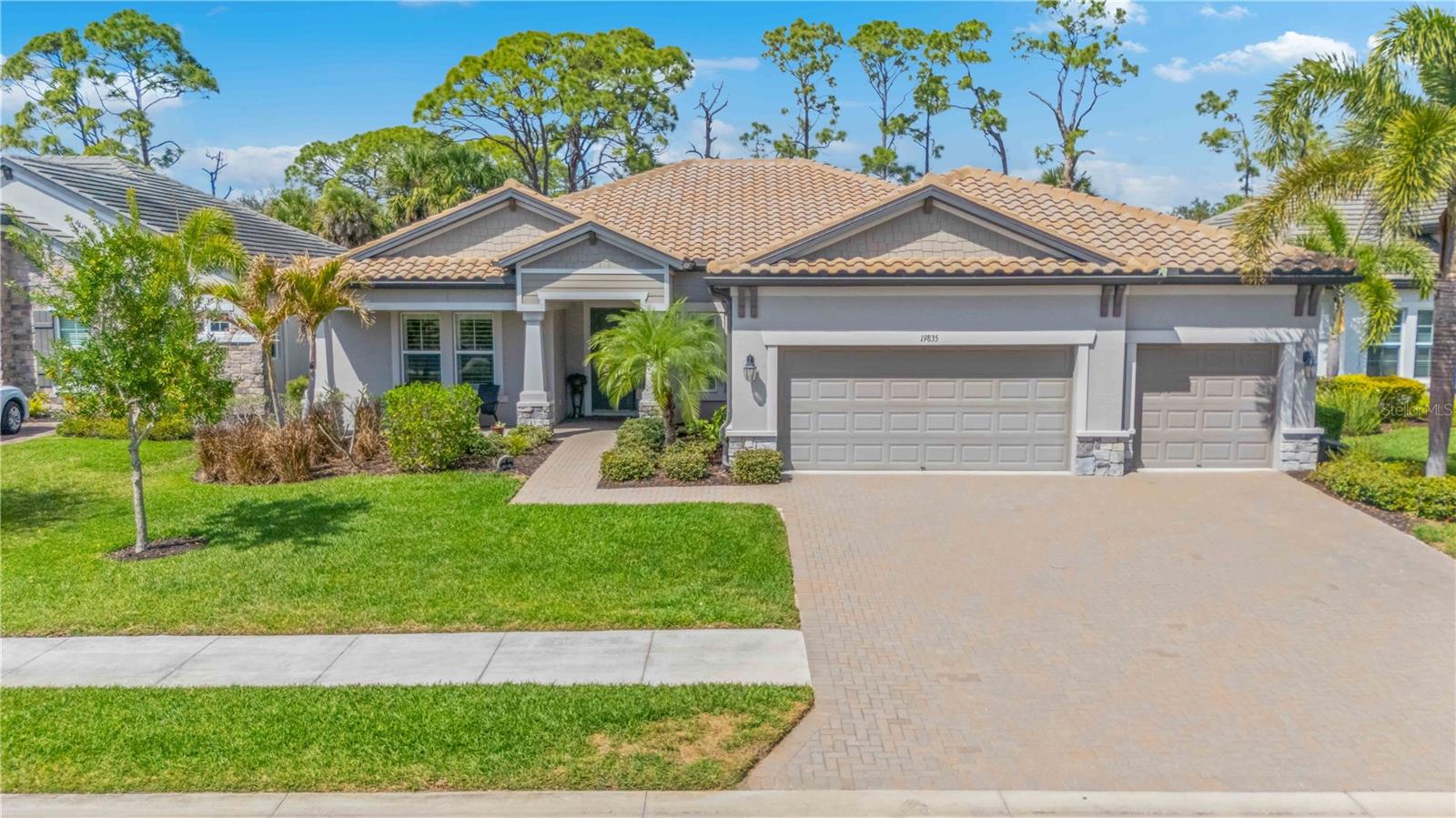 Welcome to your private slice of paradise in the exclusive, maintenance-free gated community of Oasis at Wellen Park. Positioned on a premium preserve lot with no homes behind, this beautifully maintained 2,562-square-foot pool home offers exceptional privacy, tranquility, and resort-style Florida living. Recently price-adjusted under $700,000 and move-in ready, the home features soaring ceilings, abundant natural light, plantation shutters, crown molding, and an open-concept design. The gourmet quartz kitchen with induction cooktop overlooks the spectacular outdoor living area.The highlight of the home is the heated saltwater pool and one of the area's largest oversized spas, all within an expansive screened lanai featuring smartphone controls and hookups for a future outdoor kitchen. Whether enjoying a quiet morning coffee or entertaining guests, this outdoor retreat is designed for year-round enjoyment. The flexible floor plan includes 3 spacious bedrooms, a private den/office or 4th bedroom, plus a rear flex room ideal for a craft room, fitness studio, hobby space, or oversized pantry. A pool bath and spacious 3-car garage with epoxy flooring add convenience and functionality. Located in a quieter, low-traffic luxury neighborhood just minutes from Downtown Wellen Park and Gulf Coast beaches, this home offers the perfect balance of peaceful living and accessibility. Residents enjoy a welcoming, pet-friendly environment with sidewalks throughout the community, a dog park nearby, pickleball court, clubhouse, and community pool—all without the crowds often found in larger developments. Most furniture may convey with an acceptable offer, providing a rare turnkey opportunity and an effortless move-in experience. Ask your agent for the interactive 3D tour. Located in desirable Zone X, no flood insurance is required. Easy to show and ready for a smooth closing.