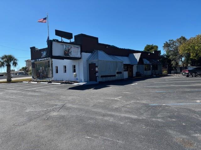 Building presently uses as Restaurant.  Present tenant is a "Tenant At Will".  Building is 3550 SF of AC space.  Has a back deck for additional seating.  Great frontage on N Tamiami Trail just North of the Airport.  Next door to another very active restaurant.  Possible owner financing.