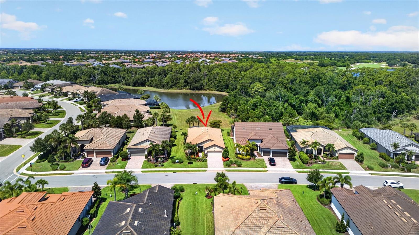 Welcome home to this beautifully updated tranquil retreat soaked with stunning sunset, pond & preserve views! Nestled on a quiet street on one of the best lots in Del Webb Lakewood Ranch where luxury meets the ultimate Florida vacation life all within your neighborhood. Why build when you can move right in and enjoy this one owner home that has been lightly lived in seasonally & is like new. This home is packed with all the right structural & design upgrades that elevate your daily living experience and create a life most only dream of. It’s been loved, appreciated, well maintained & is ready for its new family. The tiled roof & hurricane shutters provide peace of mind. As you enter the home you are greeted with stunning hard wood floors, both beautiful & easy to maintain. The open concept floor plan & high ceilings add to the homes grandeur & allow for seamless entertaining when sharing the good life with your friends & family. Your Gourmet Kitchen features high-end wood cabinetry with soft close doors, drawers, & pull-out shelves maximizing your storage & convenience. The large island features plenty of added storage & stunning new pendant lighting. Granite counters, stainless steel appliances, added recessed lighting, gas range/convection oven, range hood, large food closet & reverse osmosis water system are just a few of the extras that make your daily life a breeze while creating your favorite culinary delights. Ready to relax? This home doesn’t disappoint. Stretch out in your generously sized living room with a good book, to watch your favorite shows or simply to enjoy the amazing views year-round via 3 large pocket sliders that disappear & create seamless indoor/outdoor living when desired. The extended back lanai features a privacy wall that is pre-plumbed for a future outdoor kitchen and has a dedicated gas line for all your grilling needs. It also has a large, covered area in addition to the roll down shades that add to your convenience and year-round enjoyment. The natured peace & serenity the home offers is something to experience. Start your day by listening to the sounds of birds or enjoying preserve & pond views, end your day with some of the most beautiful sunset skies you can experience. The split floor plan features oversized bedrooms for your guests & your privacy when desired & the den makes a wonderful flex space to use any way your heart desires. Wake up every morning to the same beautiful pond & nature views from your generous owner's suite with tray ceilings, large walk-in closet, dual sink granite top wood vanities, large walk-in shower & private water closet. Casablanca fans have been added throughout the home. The 3 Car Tandem parking garage features a great workshop that can easily park 2 cars and a golf cart as is or be adjusted to fit your specific needs. It also has a dedicated LG AC & insulated garage door for completing your projects in the comfort of a temperature-controlled environment. Upgraded laundry room offers wood cabinetry, counters, sink, washer & gas dryer. Gas water heater and reclaimed irrigation complete the home. Maintenance free living allows you time and freedom to enjoy the restaurant, and amazing amenities offered in Del Webb. Your dedicated lifestyle manager is just a call or golfcart ride away to help you make the most of this elevated lifestyle. Don’t miss the opportunity to make this amazing home with fabulous private views your today. Ready for an amazing life? Just say yes!!