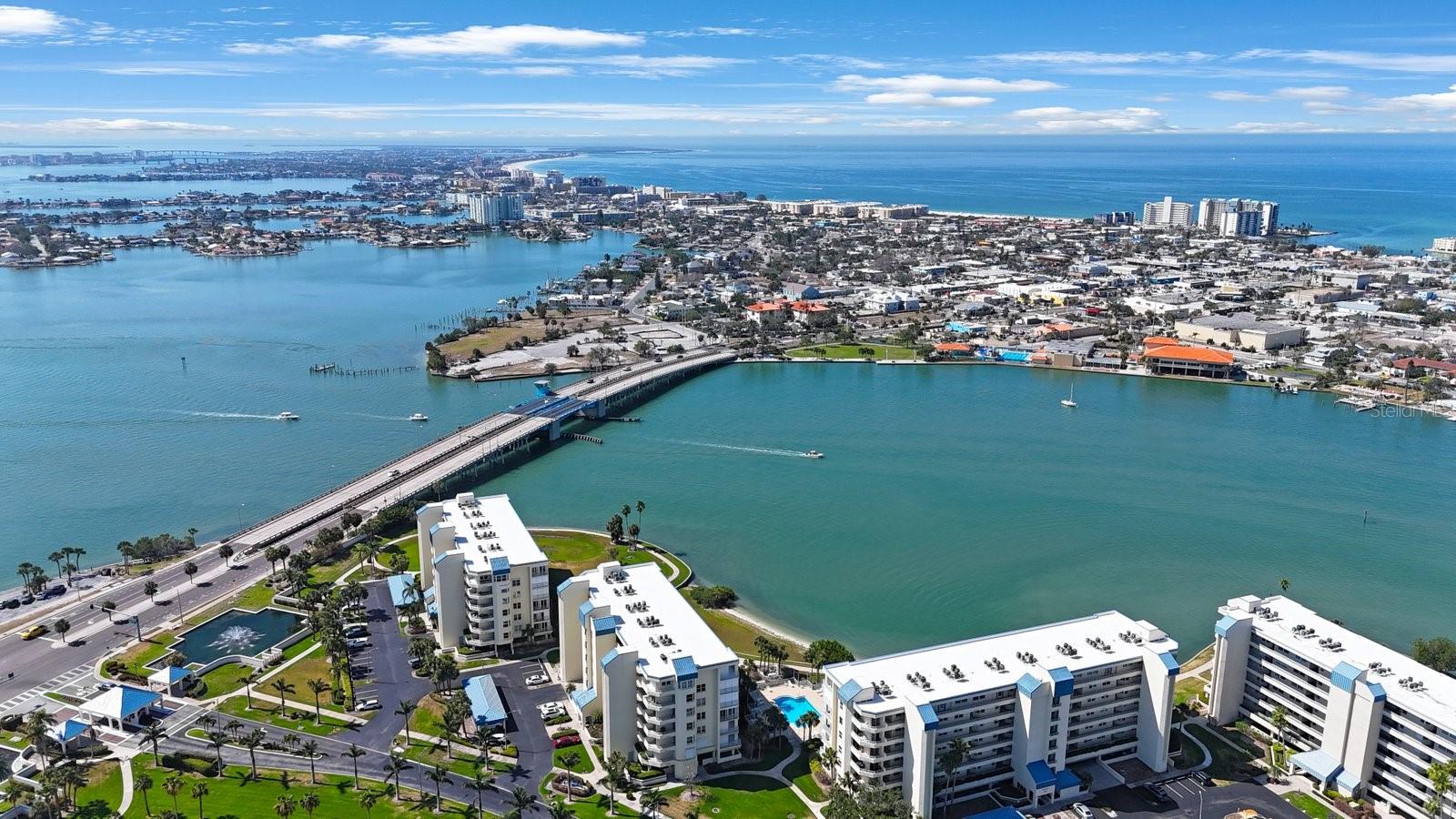 PRICED TO SELL! Penthouse with Unbelievable Water Views at BayWatch at Harbourside. Discover luxurious penthouse living in this unique 1,990 sq. ft. condo, one of only 10 on the island. Enjoy panoramic water views from the living room, dining room, kitchen, and both bedrooms. The unit features an open floor plan, is move-in ready, and comes furnished. This is your opportunity to experience the best of BayWatch at Harbourside with resort-style island living. • Abundant Marine Life: Frequent sightings of dolphins, manatees, and various sea birds are common in the calm, protected waters of the Intracoastal Waterway and shallow bay areas. • Stunning Sunsets: West-facing balconies provide prime, unobstructed views of the sun setting over the water. • Active Waterways: You can watch a constant parade of sailboats, yachts, and other vessels, making the view dynamic and interesting • Interior highlights Flexible living space: Two bedrooms, two baths, and a den that can function as an office, media room, or third bedroom. • Gourmet kitchen: Includes a central island with cabinets, two pantries, a wall oven, a microwave, reverse osmosis filtration, and eat-in space. • Custom dining room: Features built-in cabinets with a granite countertop, a snack bar, and double sliders leading to a private balcony. • Spacious primary suite: Offers two walk-in California closets and a third wall closet. The en-suite bathroom includes a water closet, two vanities, a soaking tub, and a separate walk-in shower. • Convenient laundry: A full-size side-by-side washer and dryer with storage are located in a room off the kitchen. • Quality construction: Solid steel reinforced concrete construction was used by JMC Communities, the original builder, rather than concrete blocks. Penthouse exclusives • Two assigned parking spaces: One covered carport (#118) and one space under the building (#98). • Sixth-floor storage unit: A large, conveniently located storage unit near the elevator is also included. • Private balcony: Accessed by double sliders from Primary bedroom and both the dining room and living room. Resort-style amenities • Pools and recreation: Six swimming pools, five tennis courts with two pickleball courts, and shuffleboard. • Fitness and relaxation: Two fitness centers, a Jacuzzi, and saunas. • Convenience for residents: Three outdoor grills, a three-station car wash with vacuum and air, and electric car charging stations. • Waterfront access: The marina has three docks and 87 deeded slips, which are available for rent or purchase from other owners. • Clubhouse features: A card room, billiard room, library, woodwork shop, and a grand room with a kitchen for events. • Outdoor activities: A 1.5-mile walking trail around the island offers a chance to see dolphins, manatees, and seabirds. • Pet-friendly policy: Allows one pet per unit, 20 pounds or under. This is your opportunity to experience the best of BayWatch at Harbourside and resort-style island living.